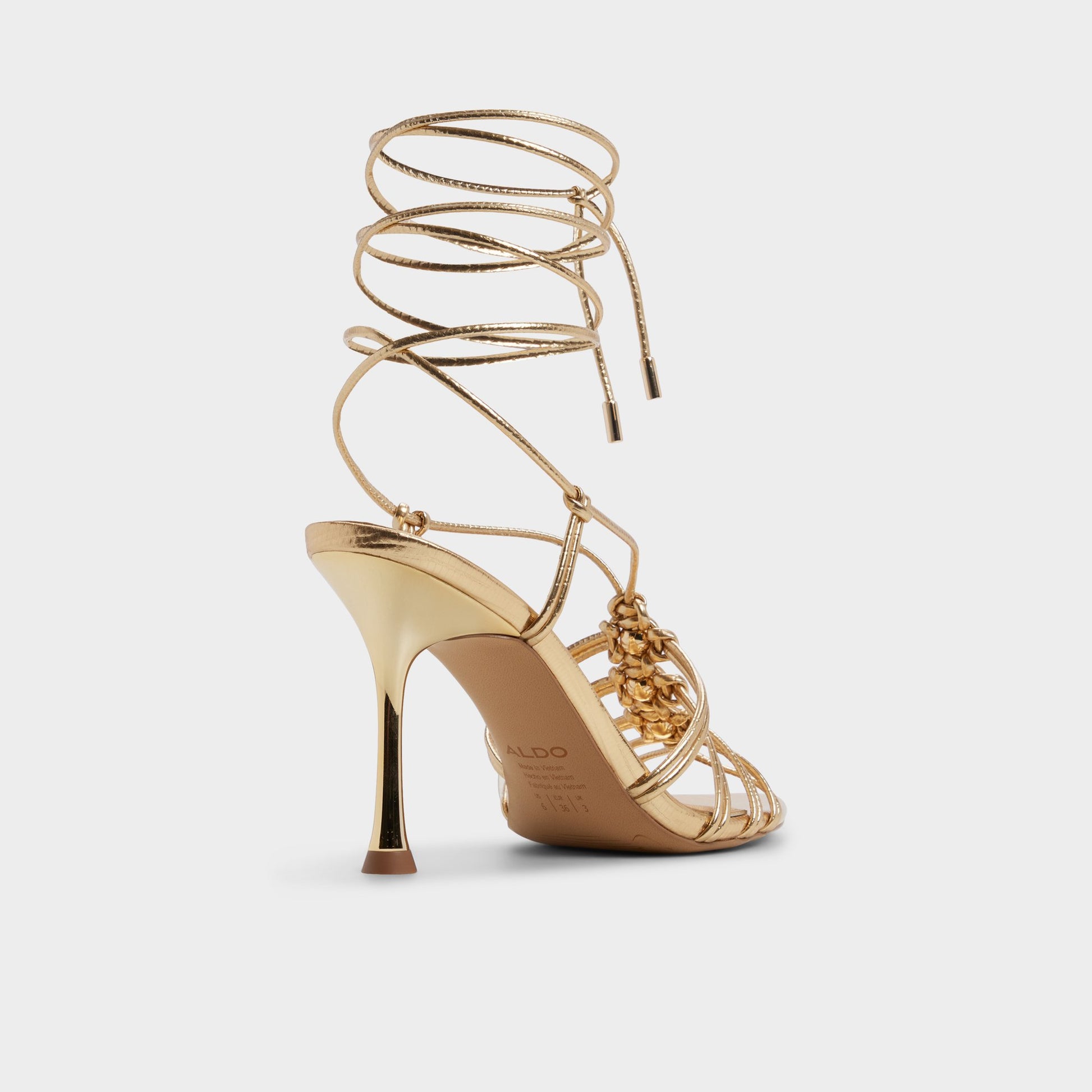 Three-quarter angle of Gold Curacao Strappy heeled sandal's back side