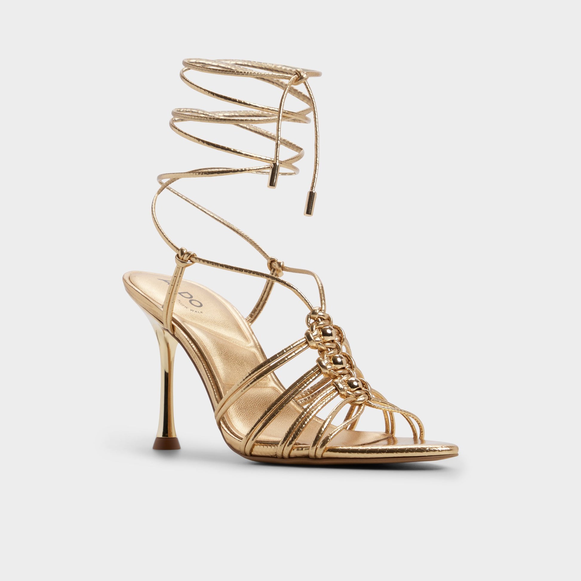 Three-quarter angle of Gold Curacao Strappy heeled sandal's front side