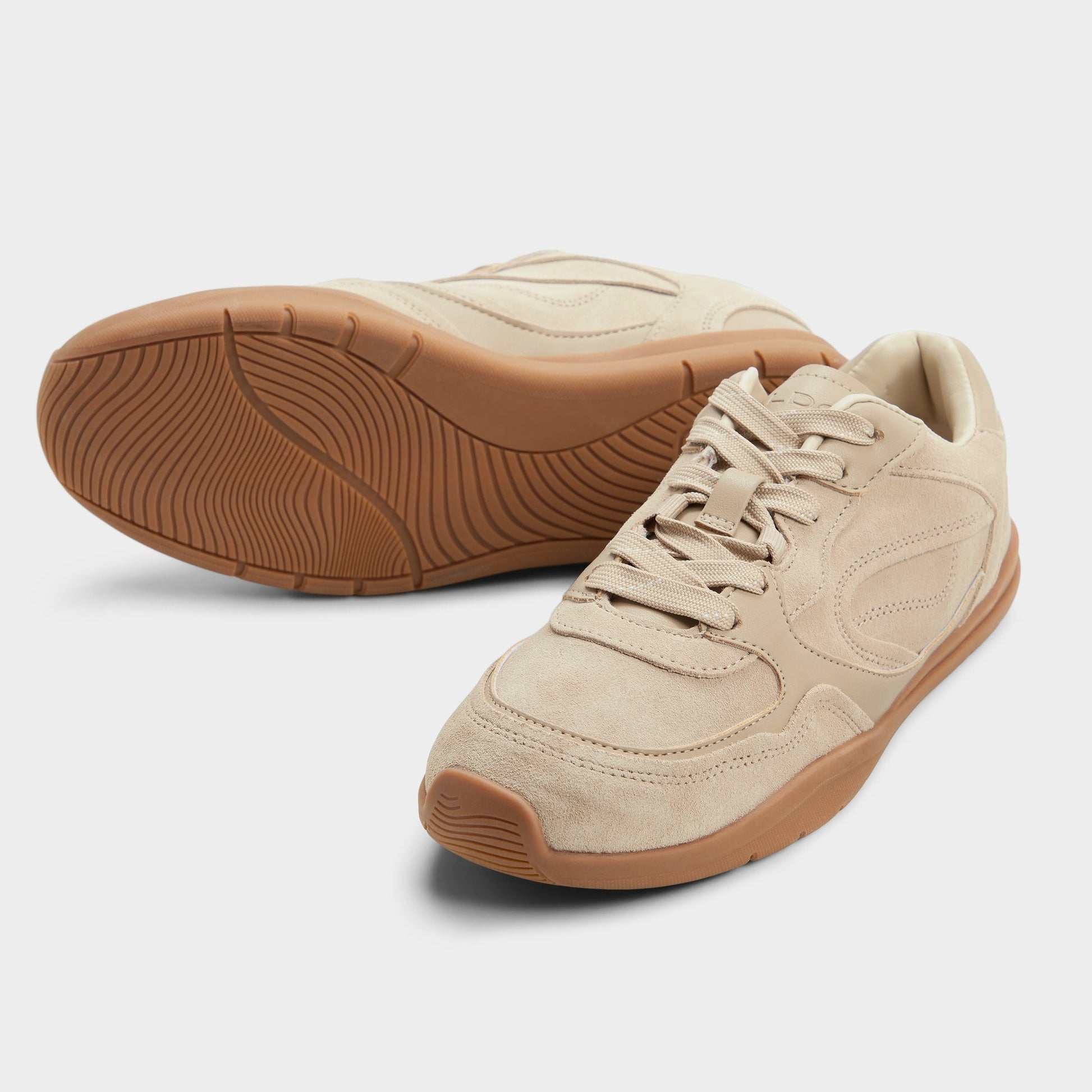 Highlighted view of a pair of Open beige Jendaya s