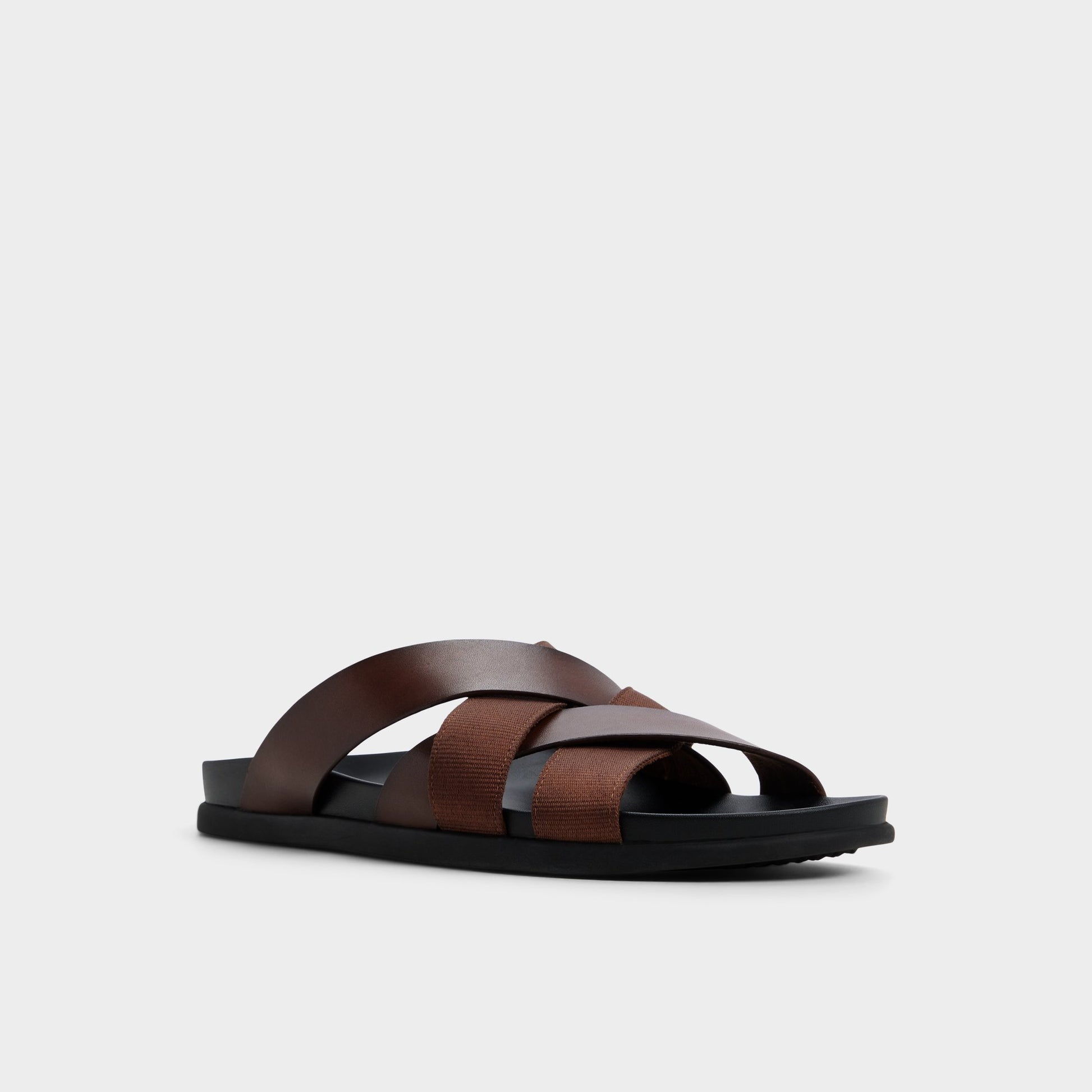 Three-quarter angle of Dark brown Florian Slide sandal's front side