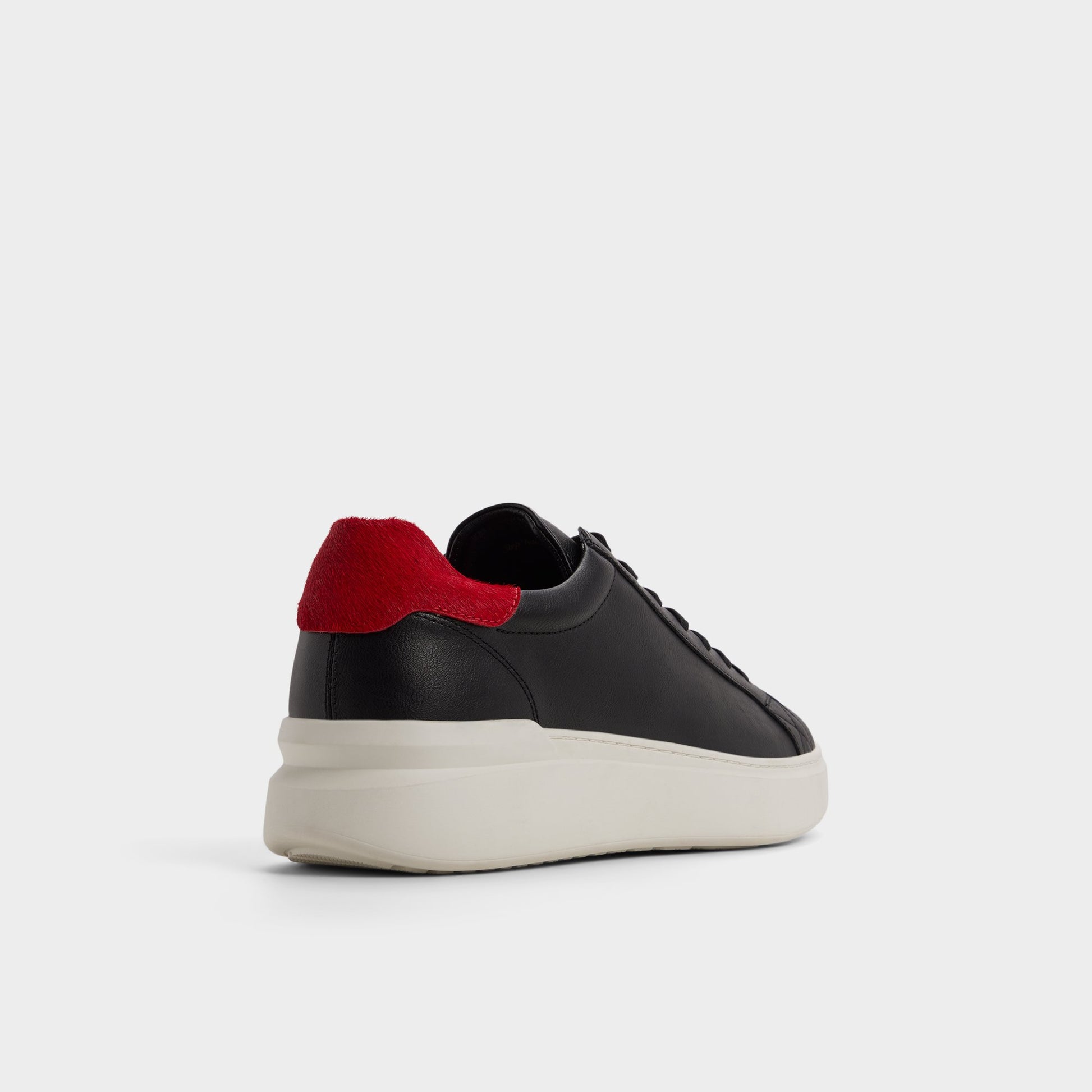 Three-quarter angle of Black Rohan Low top sneaker's back side
