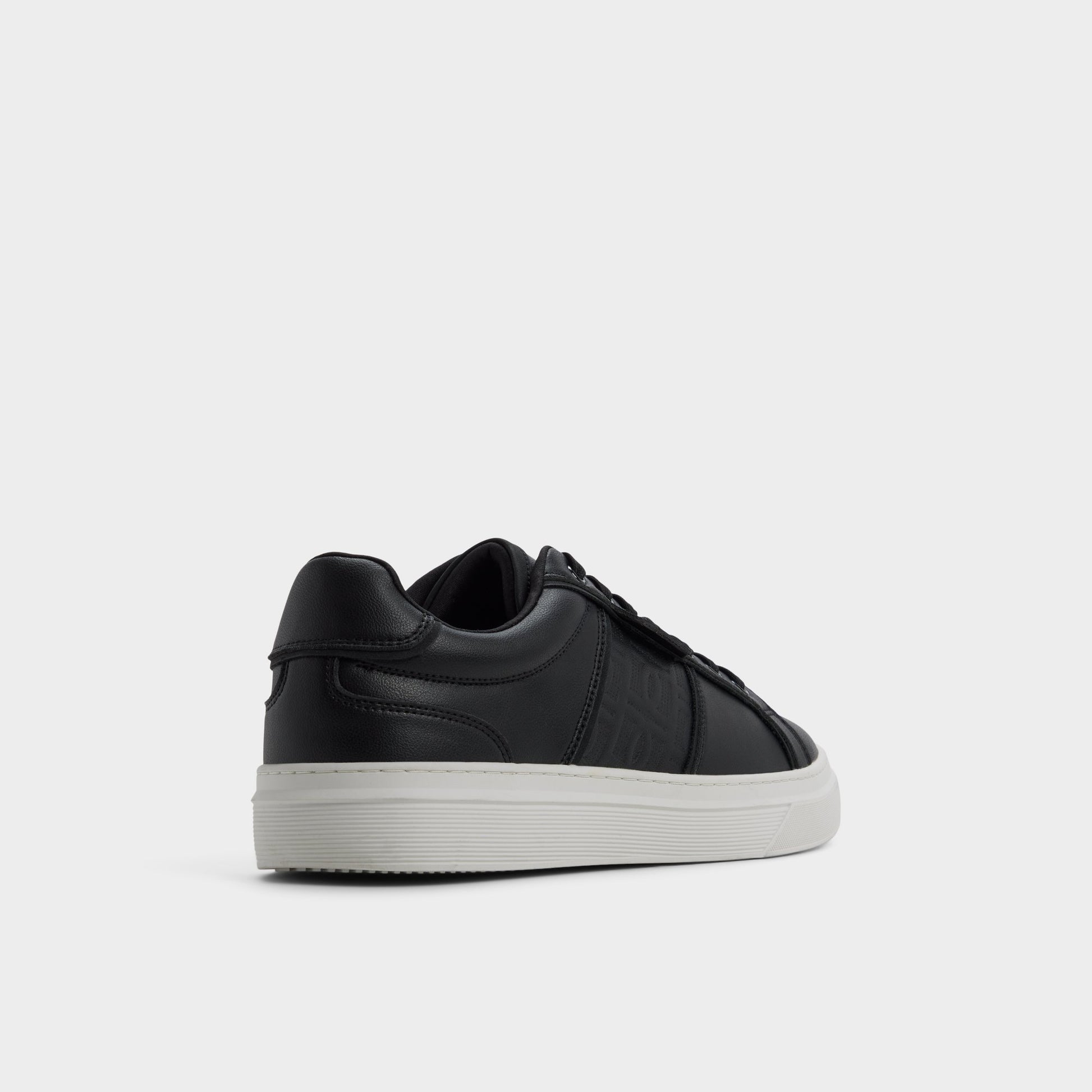 Three-quarter angle of Black/black Courtline Low top sneaker's back side