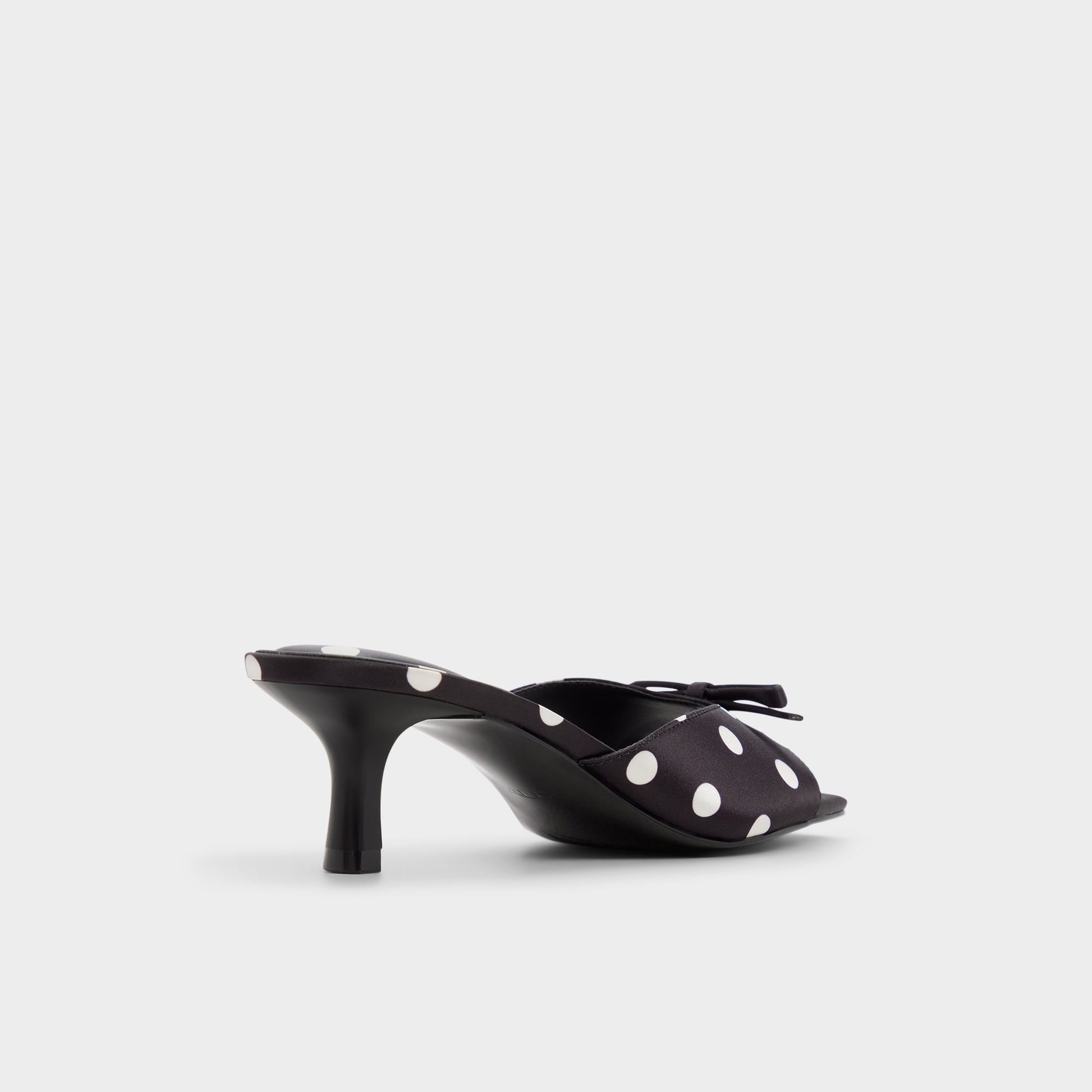 Three-quarter angle of Black/white Belerose Heeled mule's back side