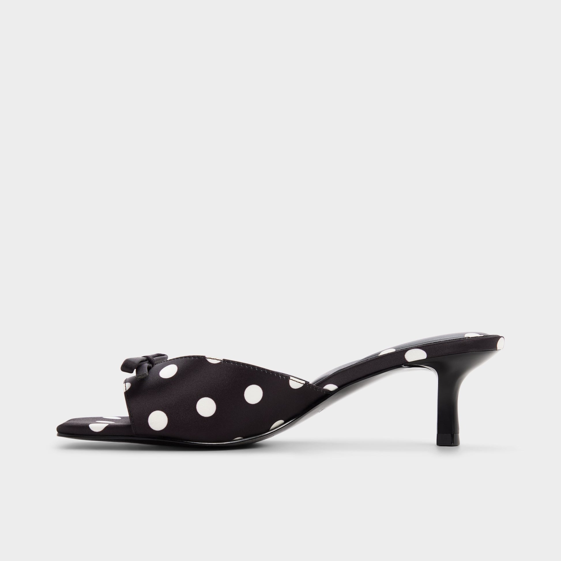 Side view of Black/white Belerose Heeled mule