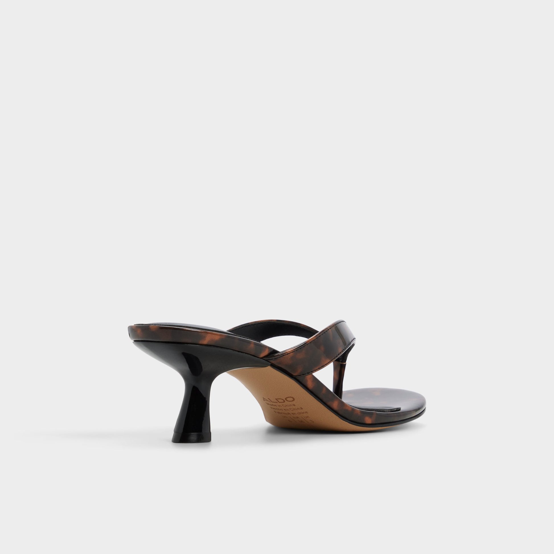 Three-quarter angle of Open brown Jump Heeled flip flop's back side