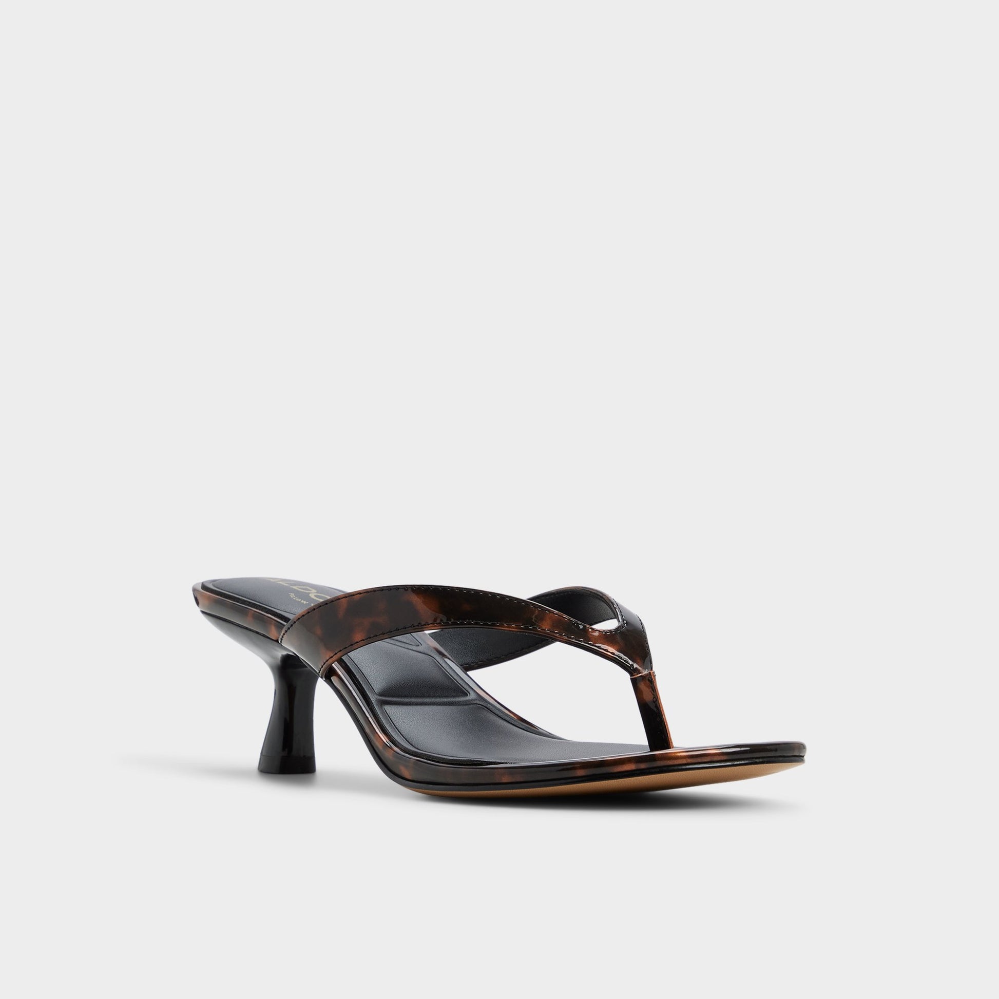 Three-quarter angle of Open brown Jump Heeled flip flop's front side