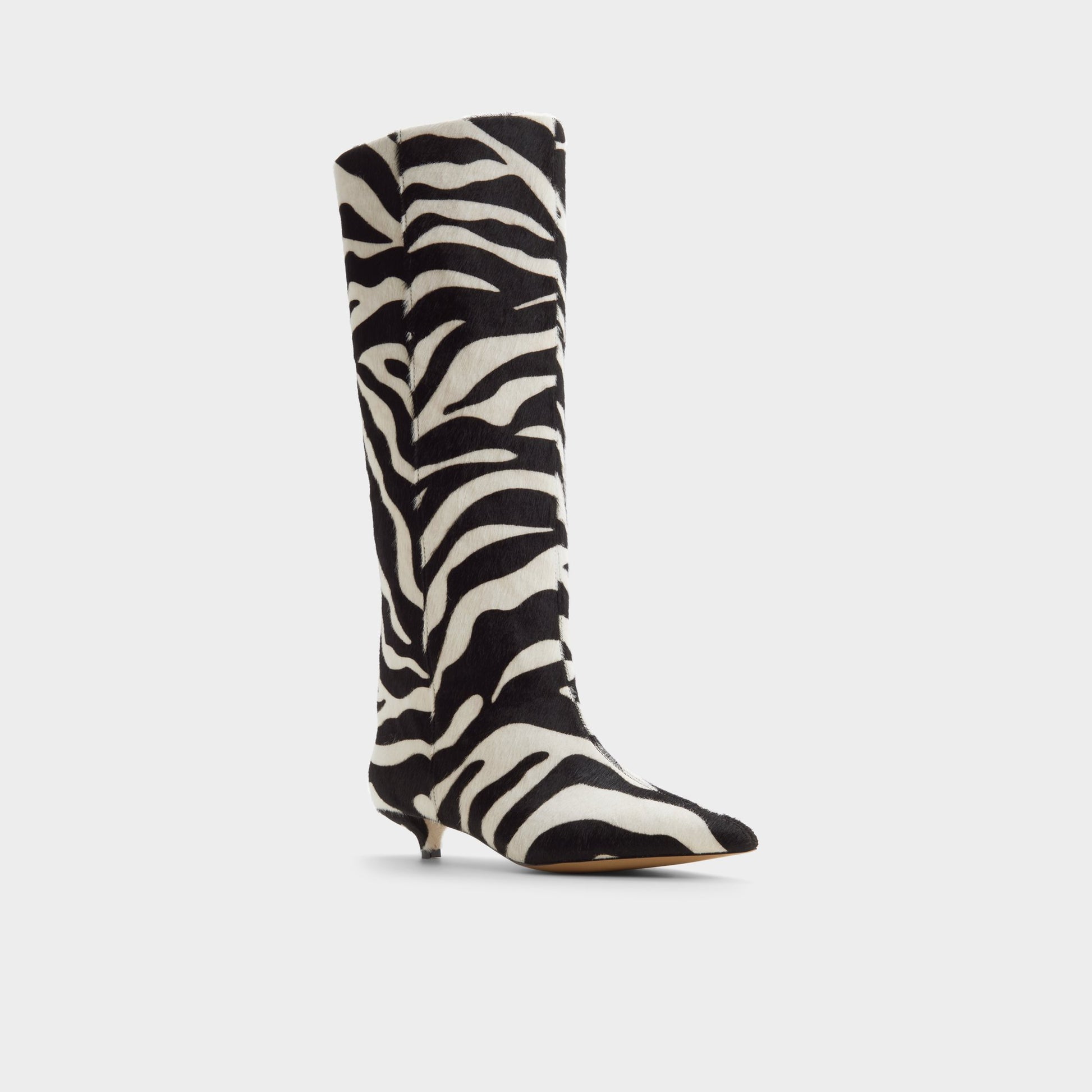 Three-quarter angle of White/black Gabelia Knee-high boot's front side