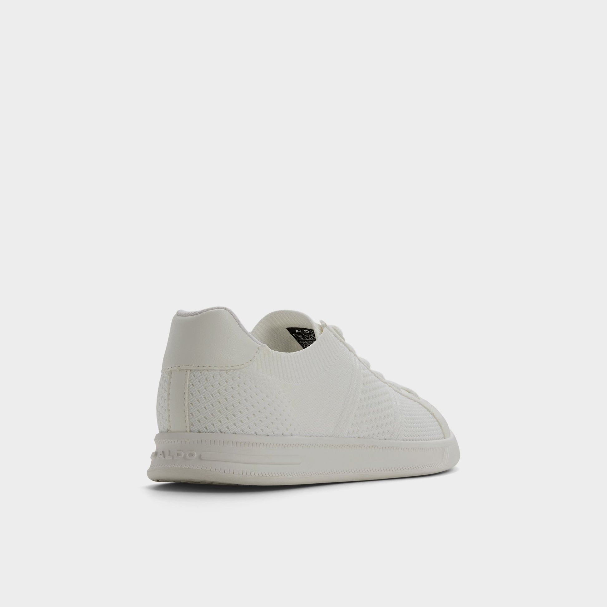 Three-quarter angle of White Joshy Low top sneaker's back side