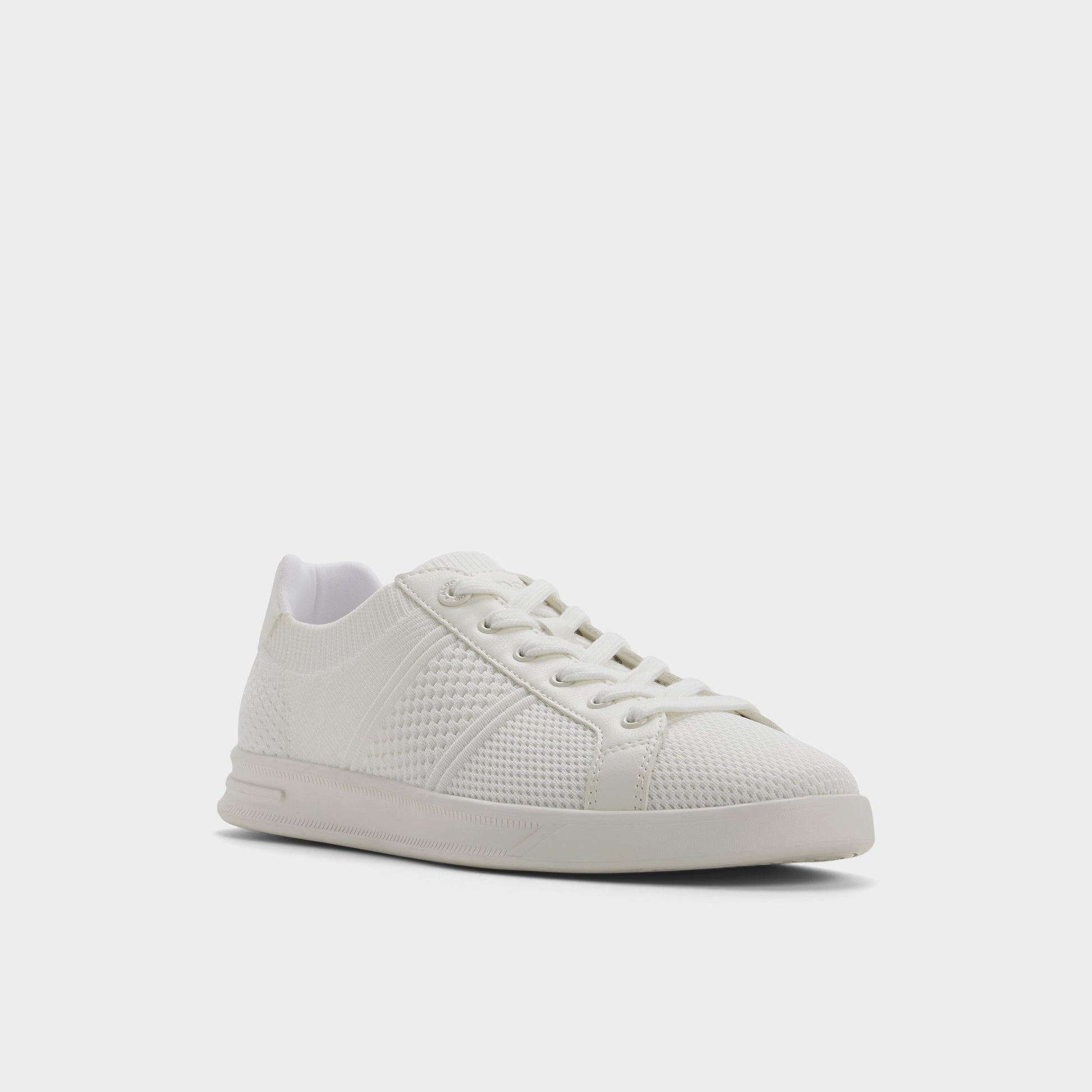Three-quarter angle of White Joshy Low top sneaker's front side