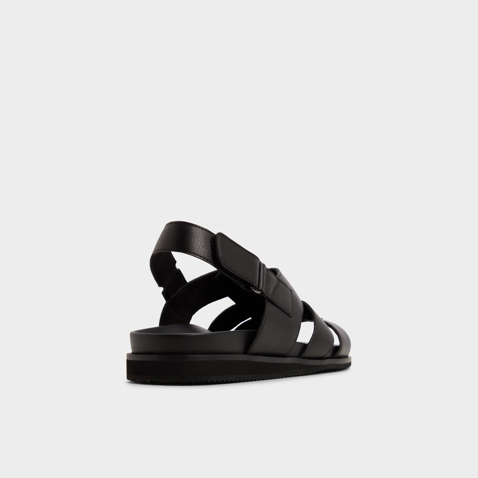 Three-quarter angle of Black/black Nuno Strappy flat sandal's back side