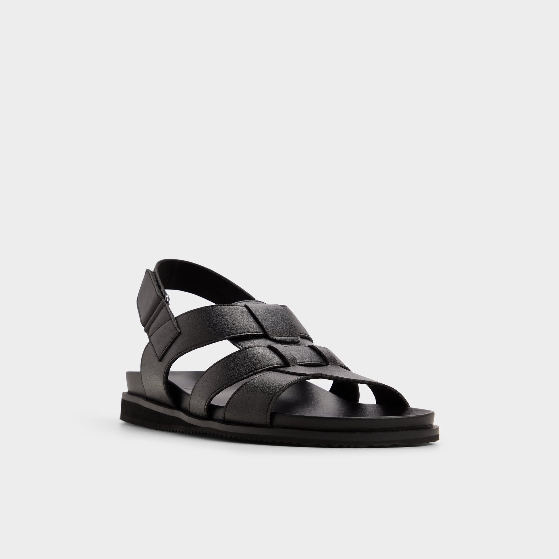 Three-quarter angle of Black/black Nuno Strappy flat sandal's front side