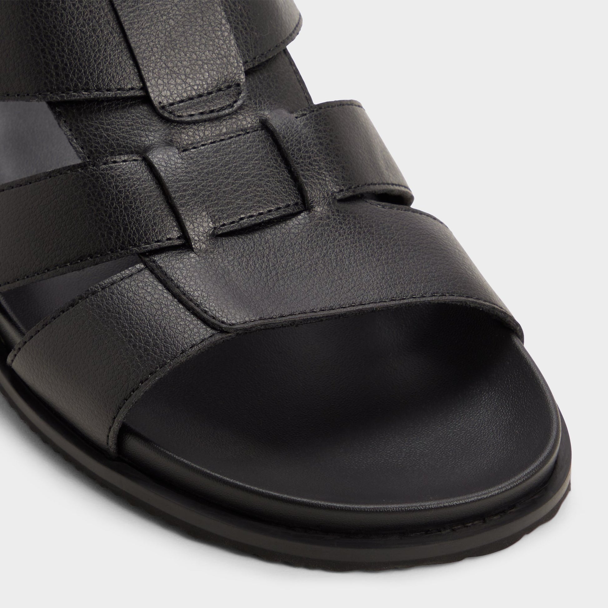 Close-up of the Black/black Nuno Strappy flat sandal