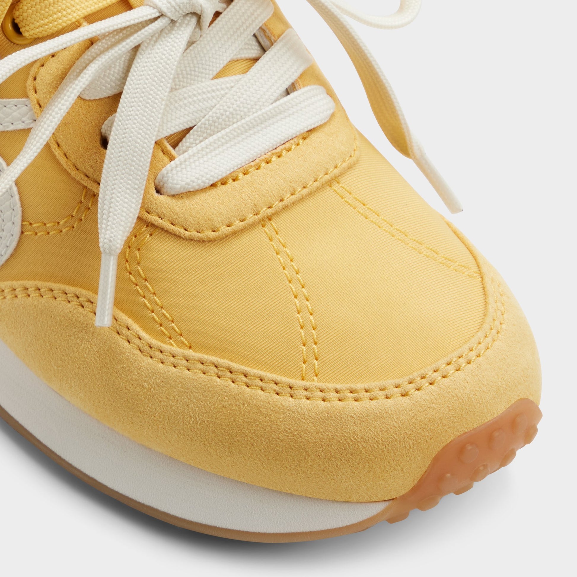 Close-up of the Medium yellow Caely Sneaker