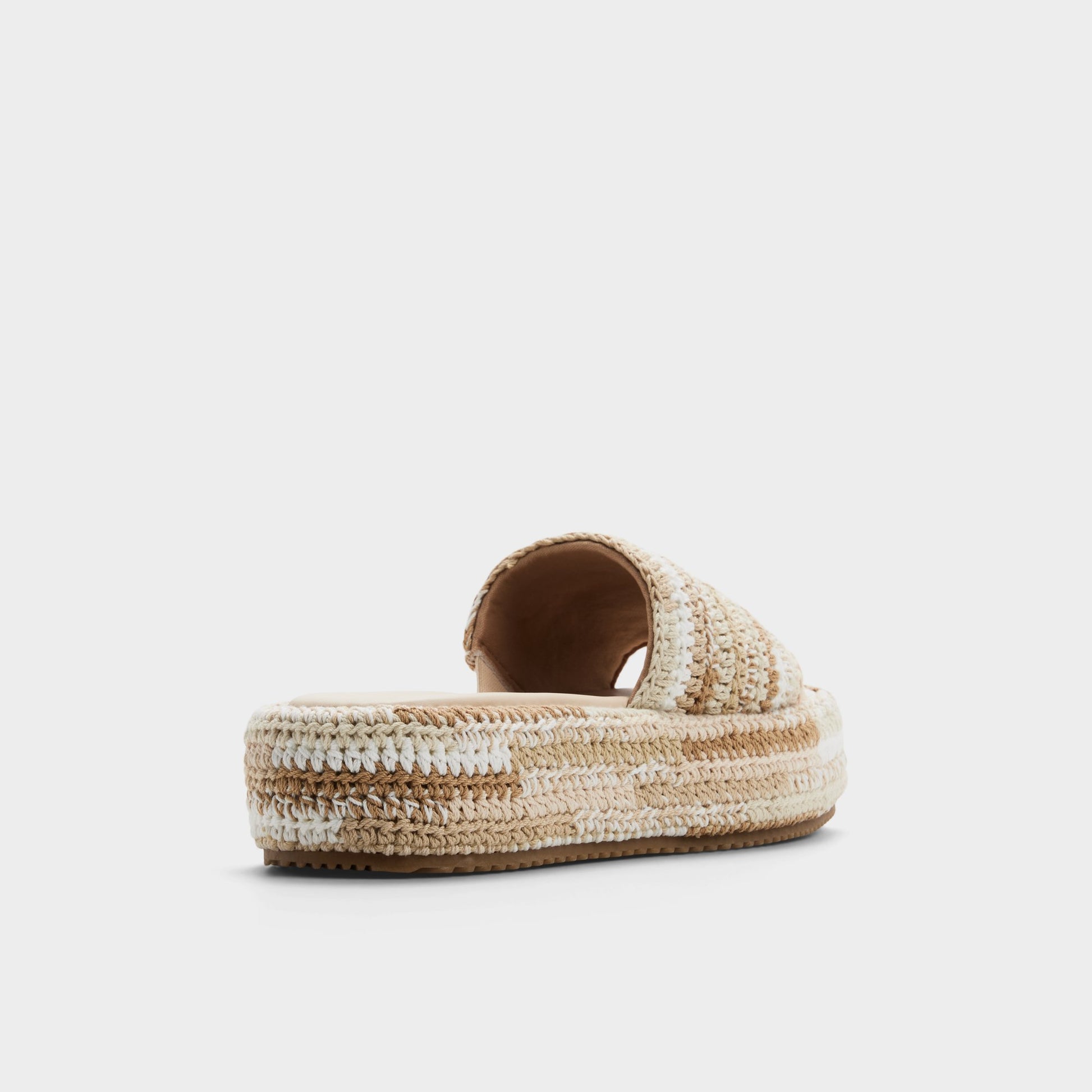 Three-quarter angle of Beige combo Bohemina Slide sandal's back side