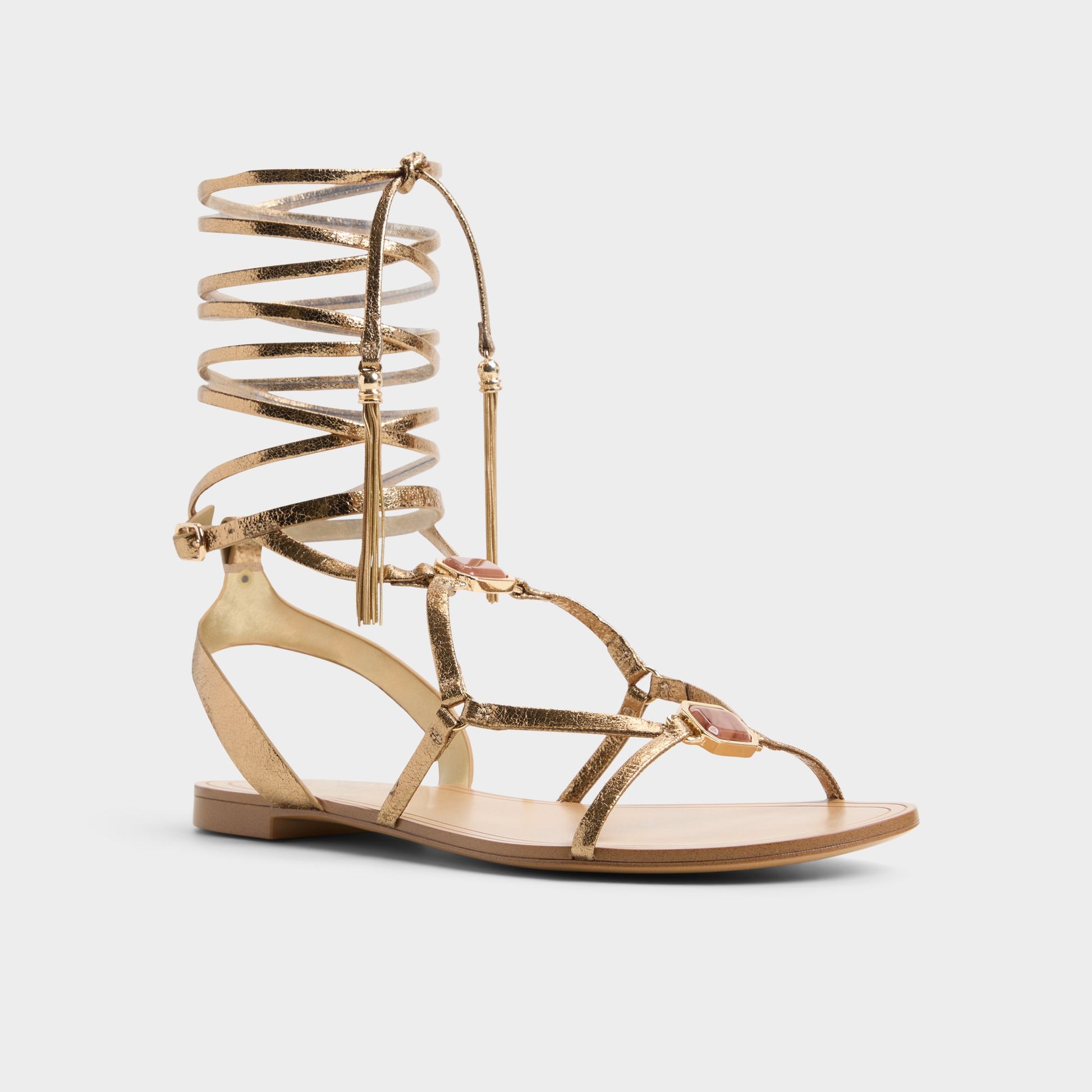 Three-quarter angle of Gold Andrina Strappy flat sandal's front side