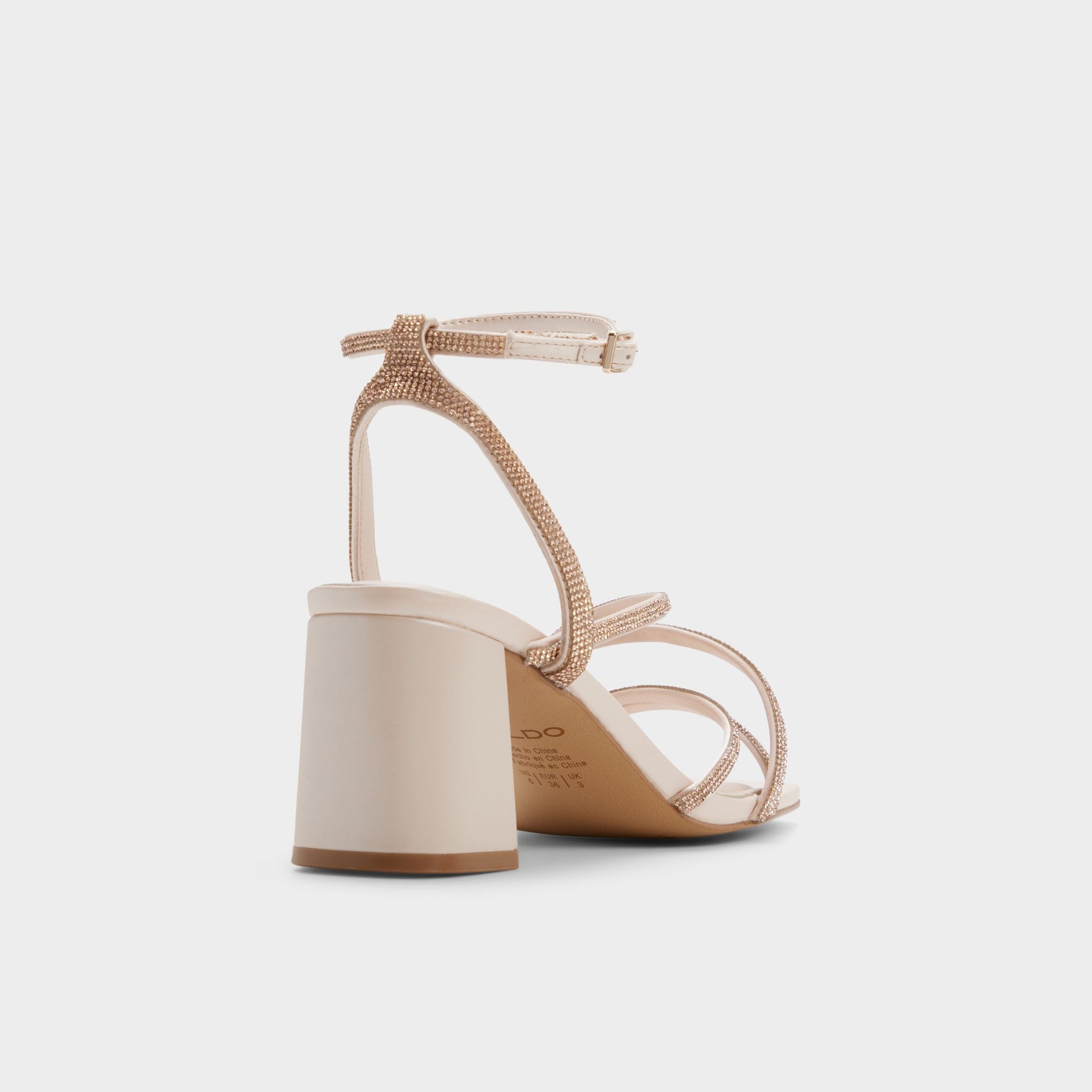 Three-quarter angle of Light beige Esther Strappy heeled sandal's back side