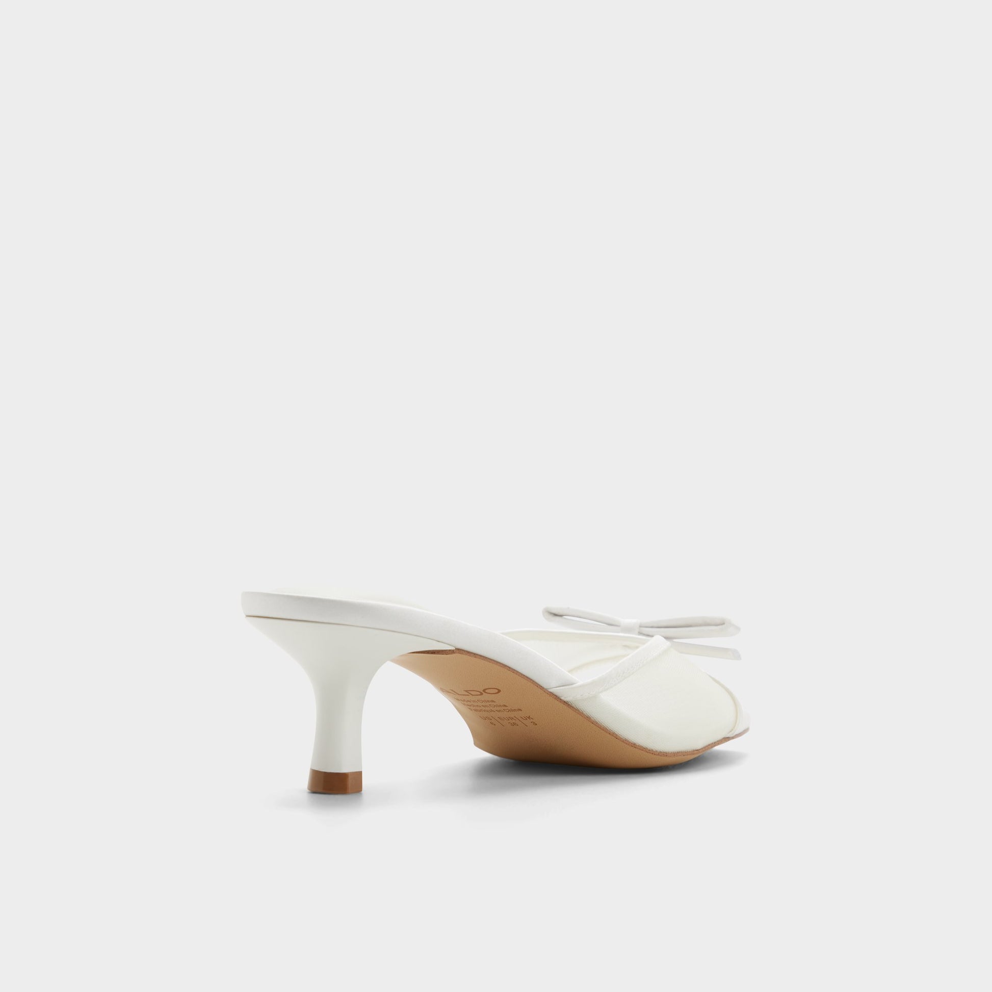 Three-quarter angle of White/bone Begoniaa Heeled mule's back side
