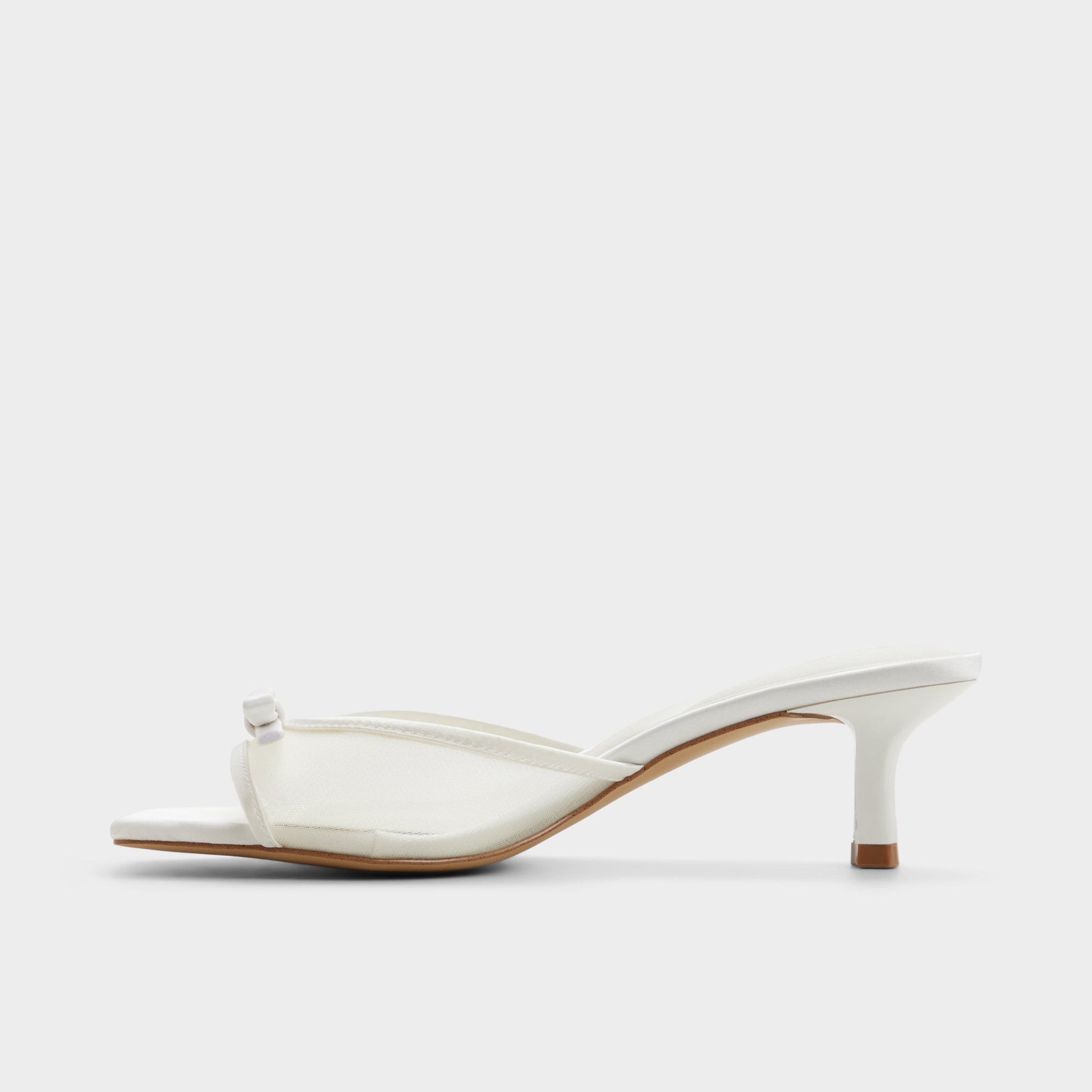 Side view of White/bone Begoniaa Heeled mule