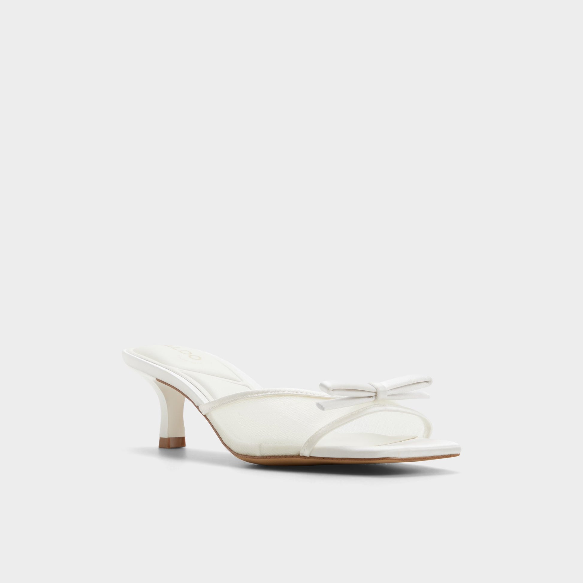 Three-quarter angle of White/bone Begoniaa Heeled mule's front side