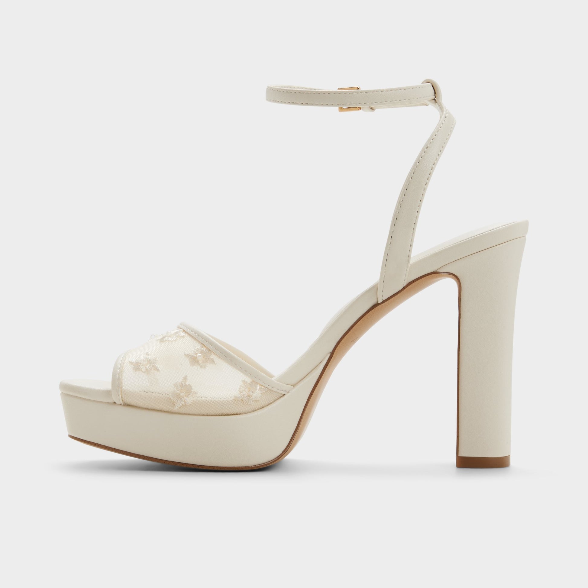 Side view of Open white Chicglimmer Strappy heeled sandal