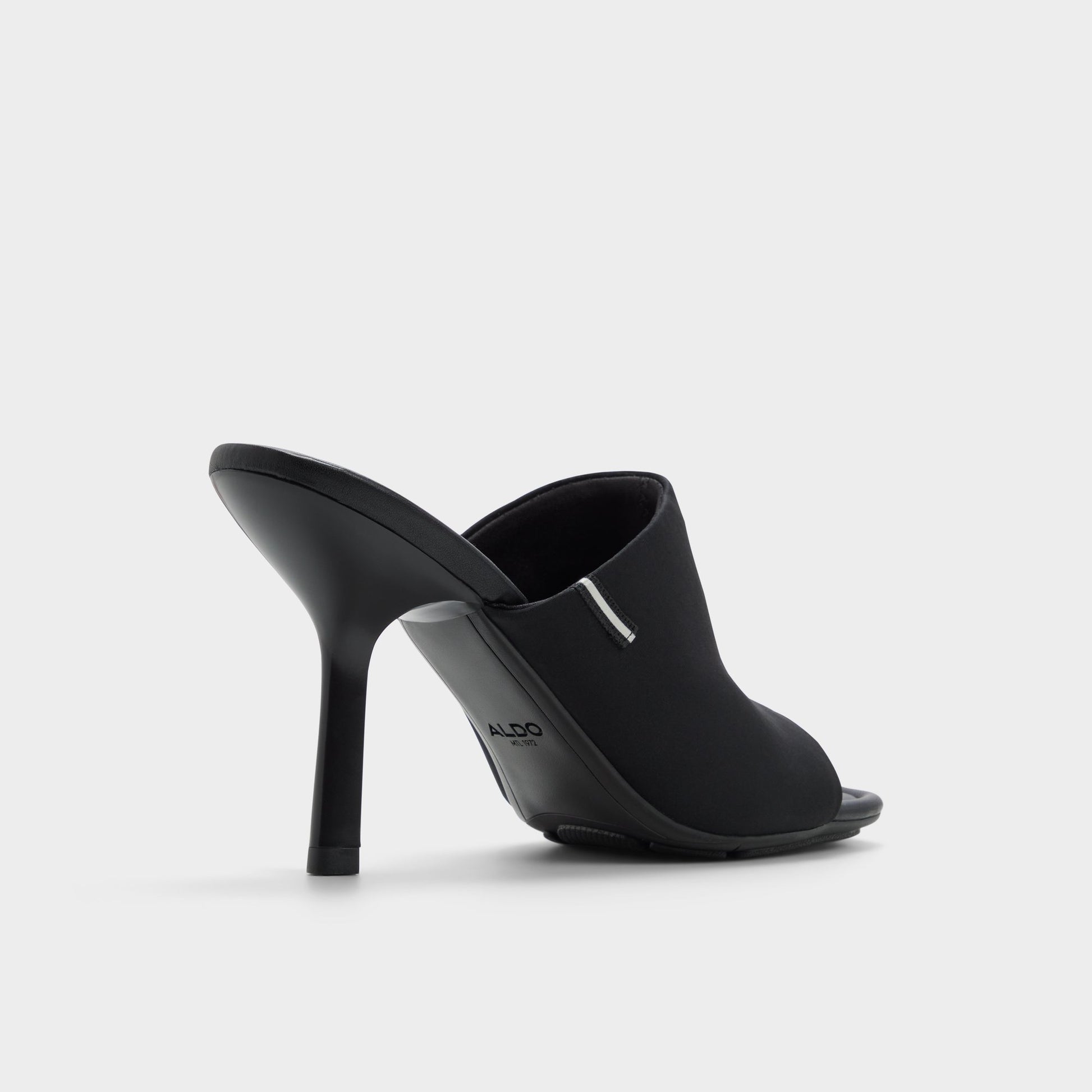 Three-quarter angle of Black Eviey Heeled mule's back side