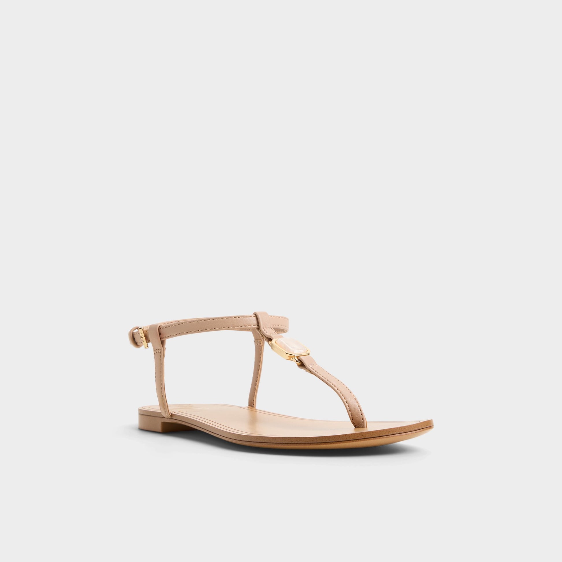 Three-quarter angle of Beige Sandstone T-strap sandal's front side