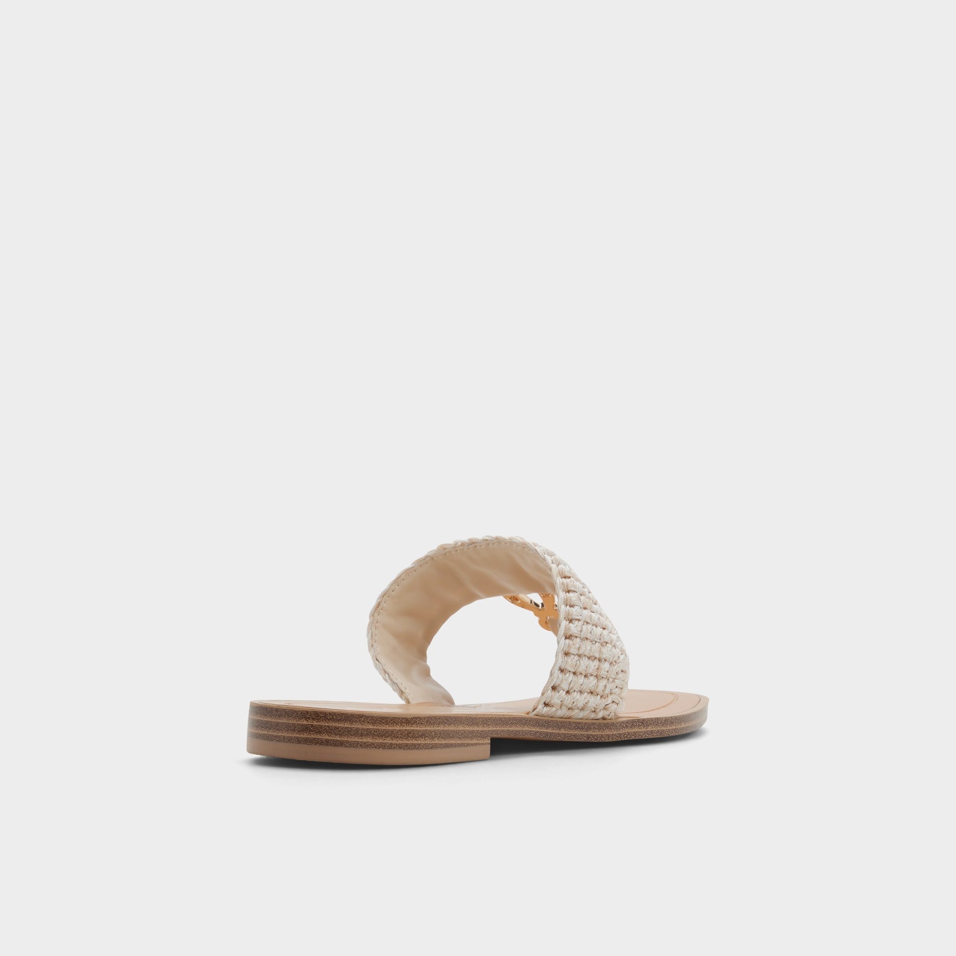 Three-quarter angle of Beige Madaline T-strap sandal's back side