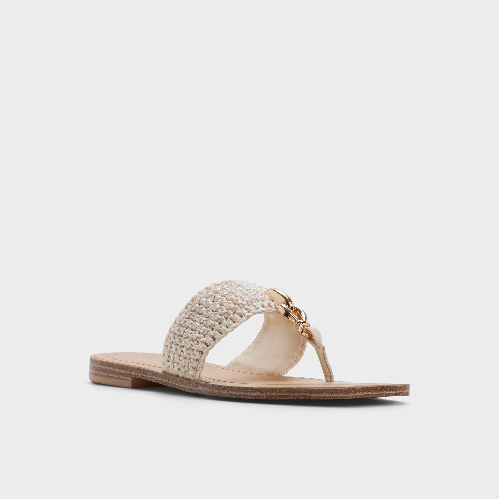 Three-quarter angle of Beige Madaline T-strap sandal's front side