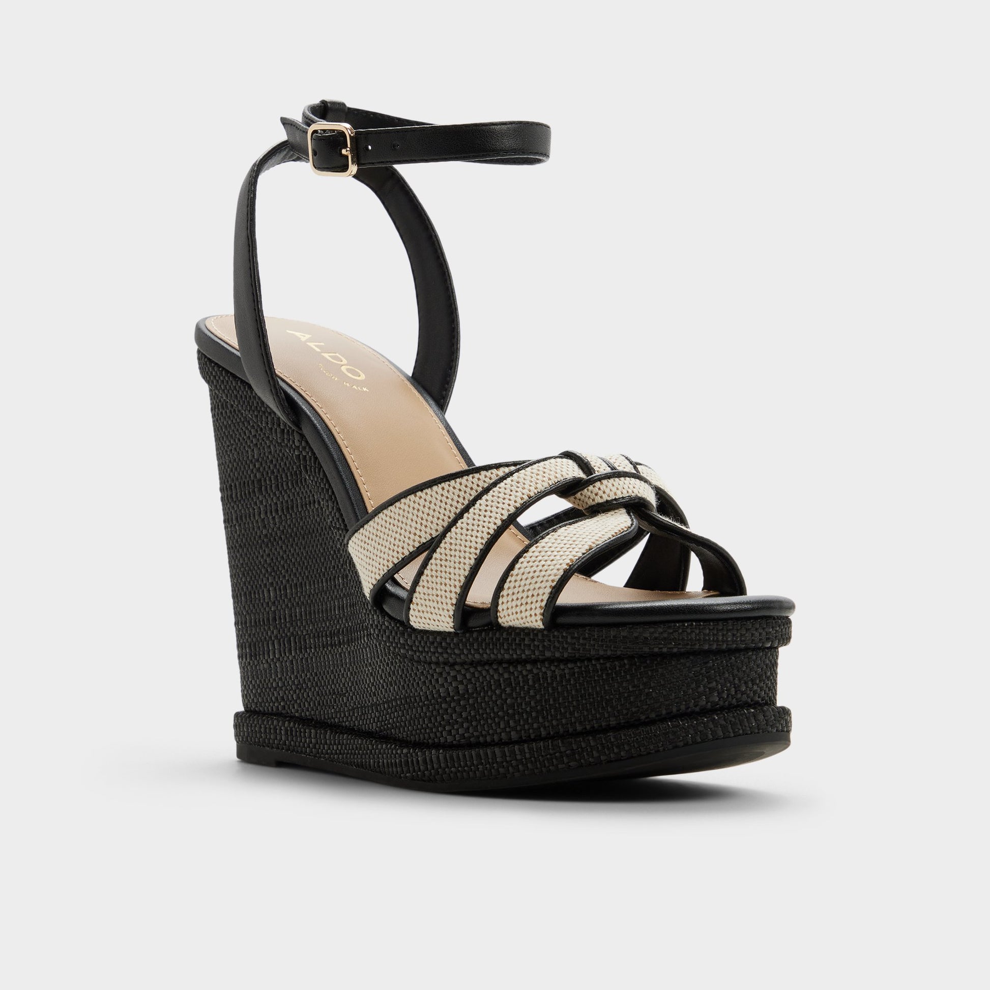 Three-quarter angle of Black combo Esmerie Wedge sandal's front side