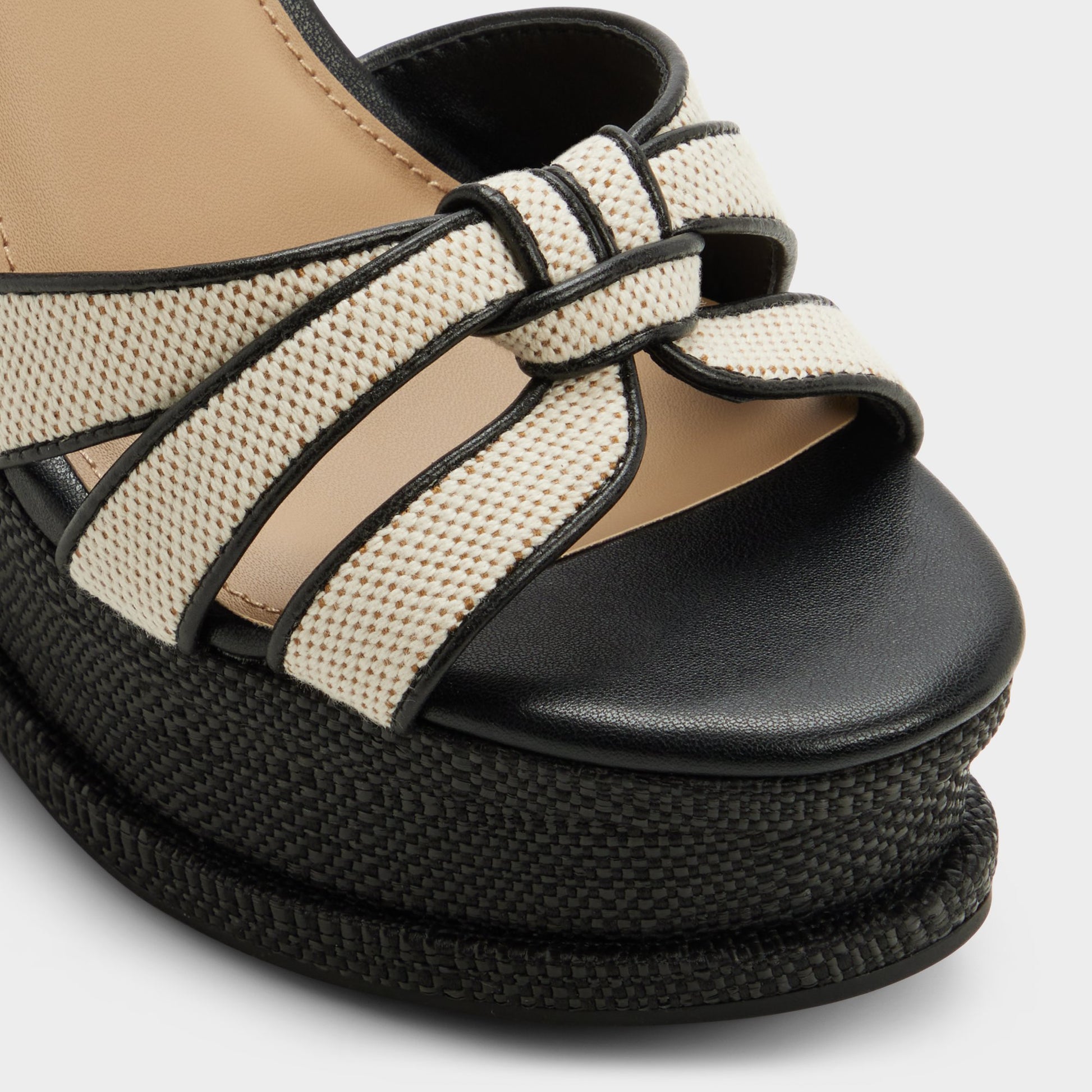 Close-up of the Black combo Esmerie Wedge sandal