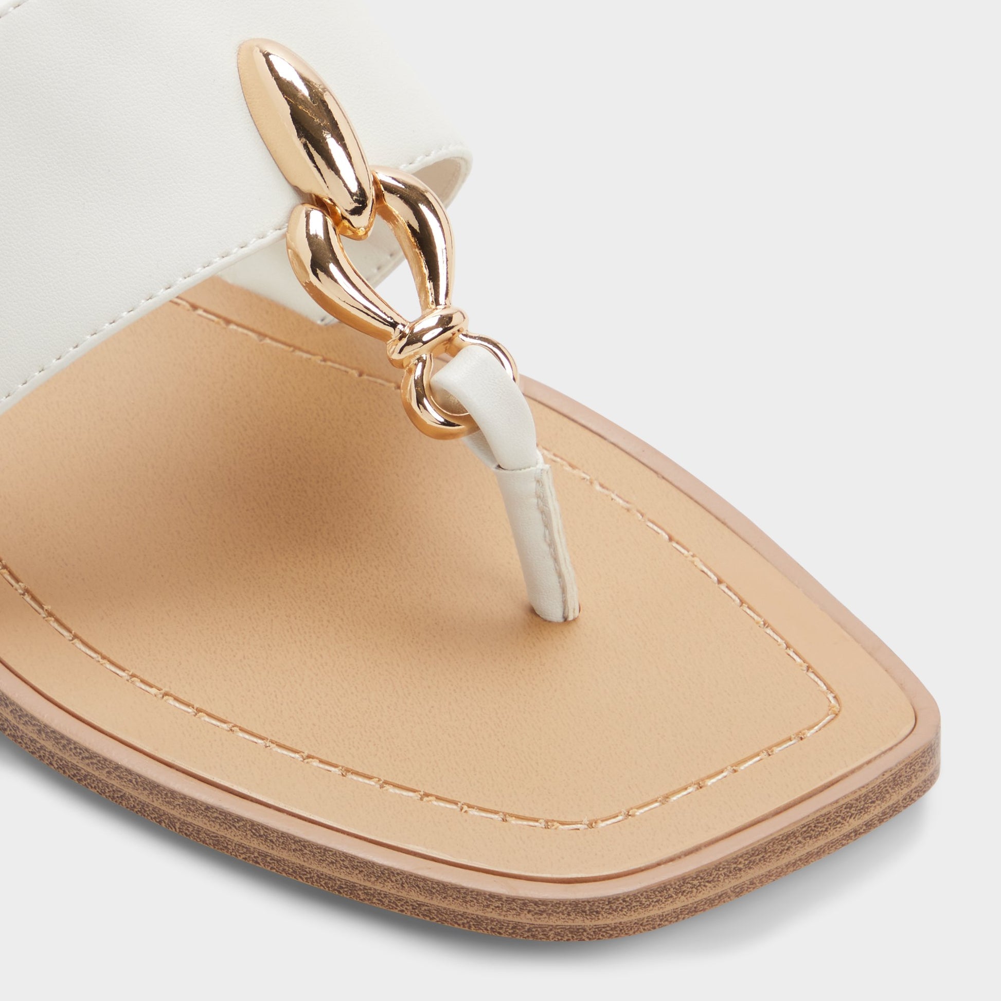 Close-up of the White/bone Madaline T-strap sandal