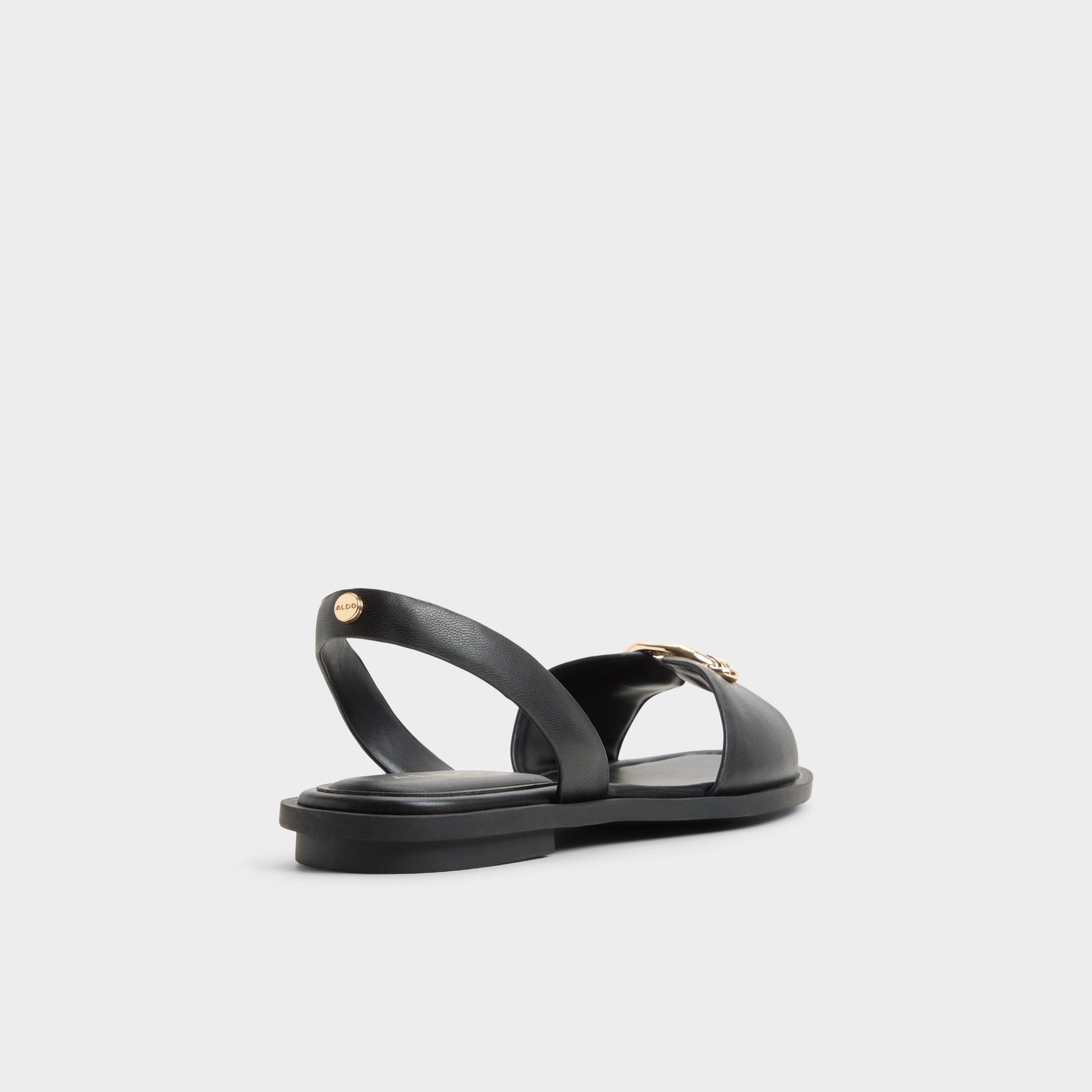 Three-quarter angle of Black Calelian Flat sandal's back side