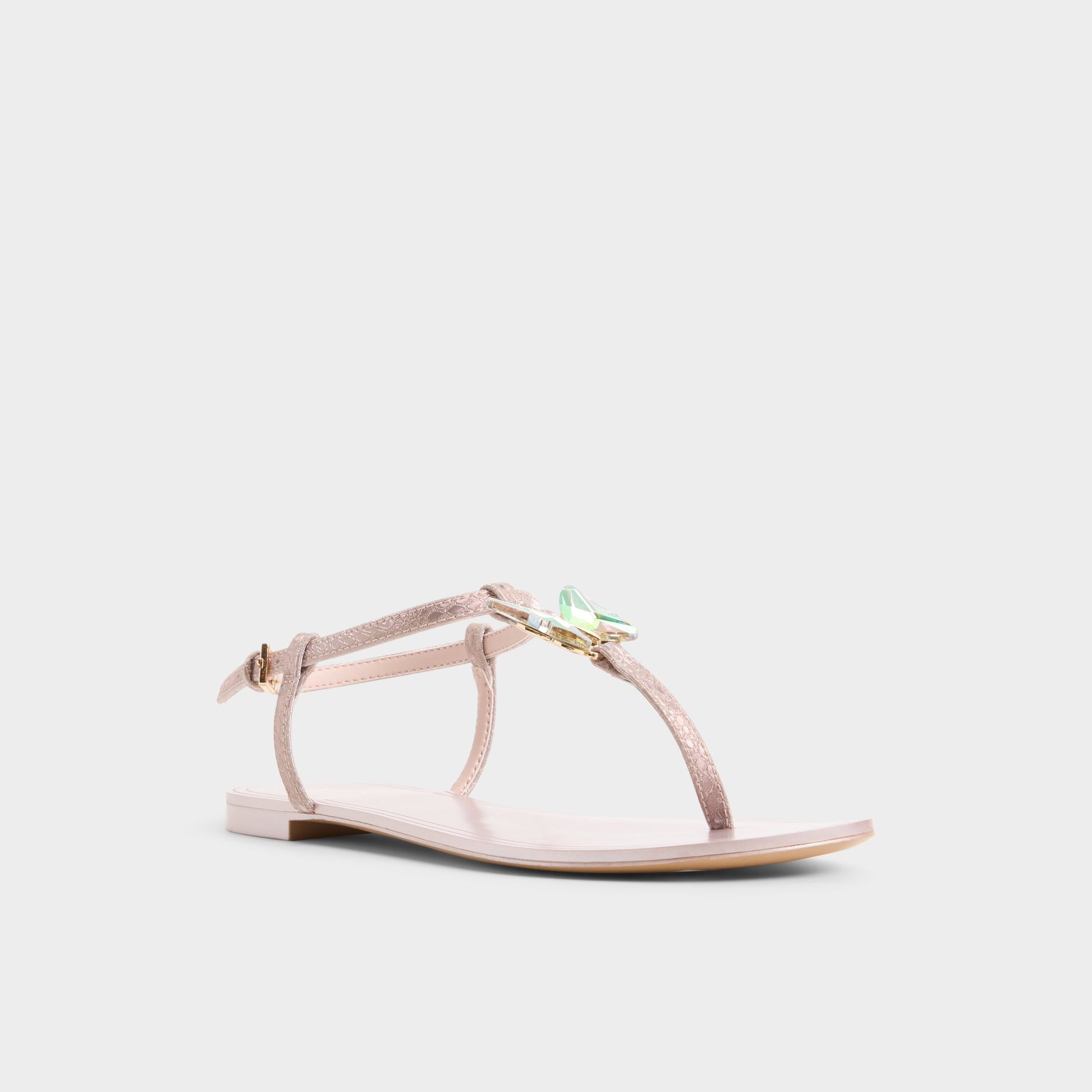 Three-quarter angle of Rose gold Farfallina T-strap sandal's front side