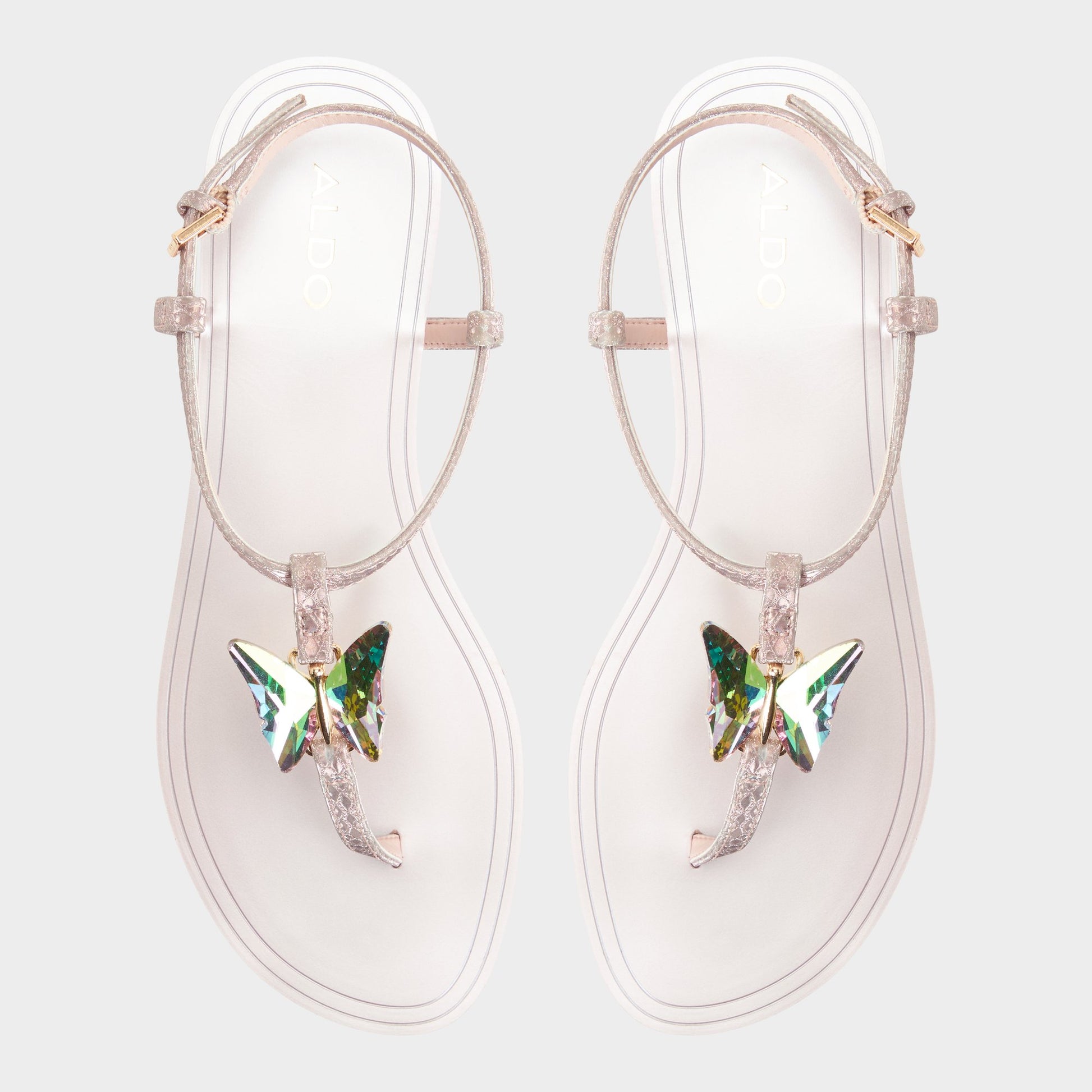 Top-down view of the Rose gold Farfallina T-strap sandal