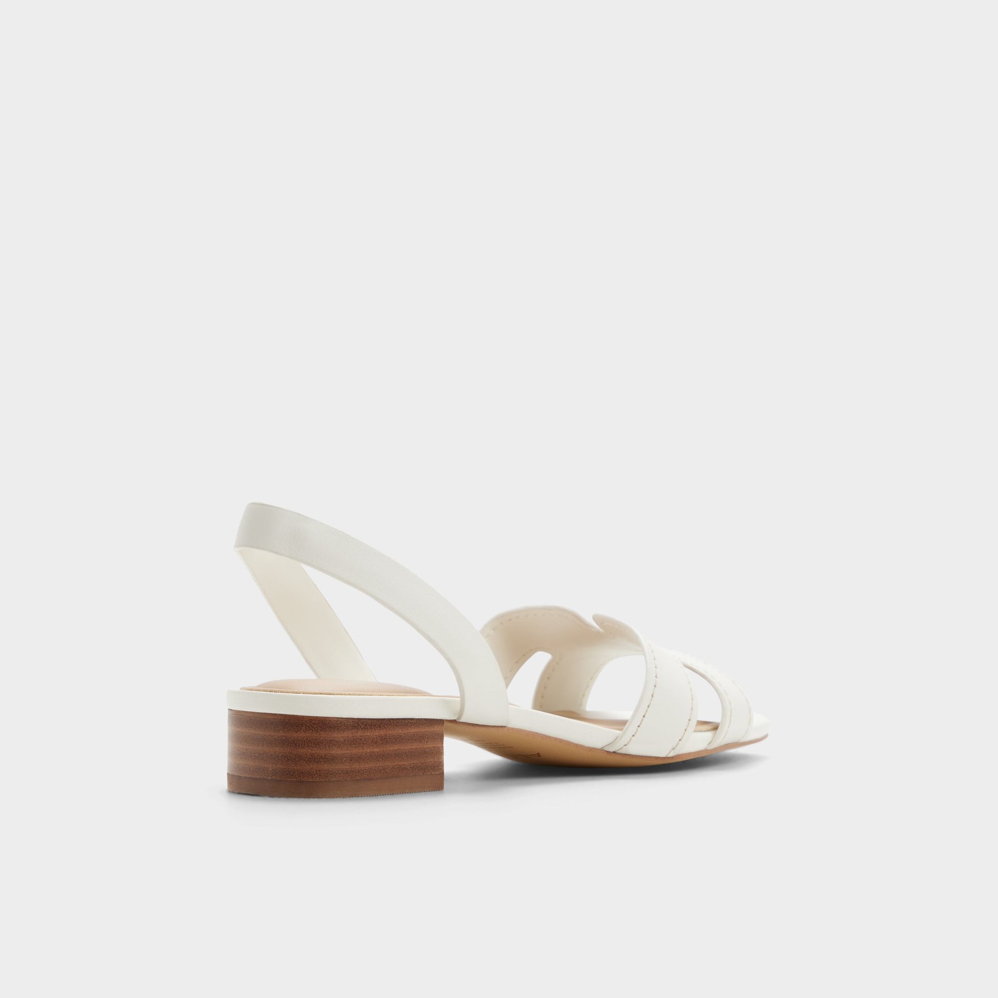 Three-quarter angle of White/bone Javamannon Strappy heeled sandal's back side
