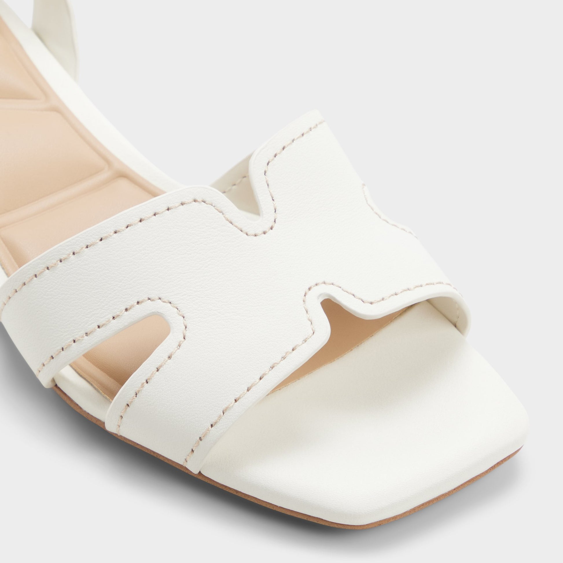 Close-up of the White/bone Javamannon Strappy heeled sandal