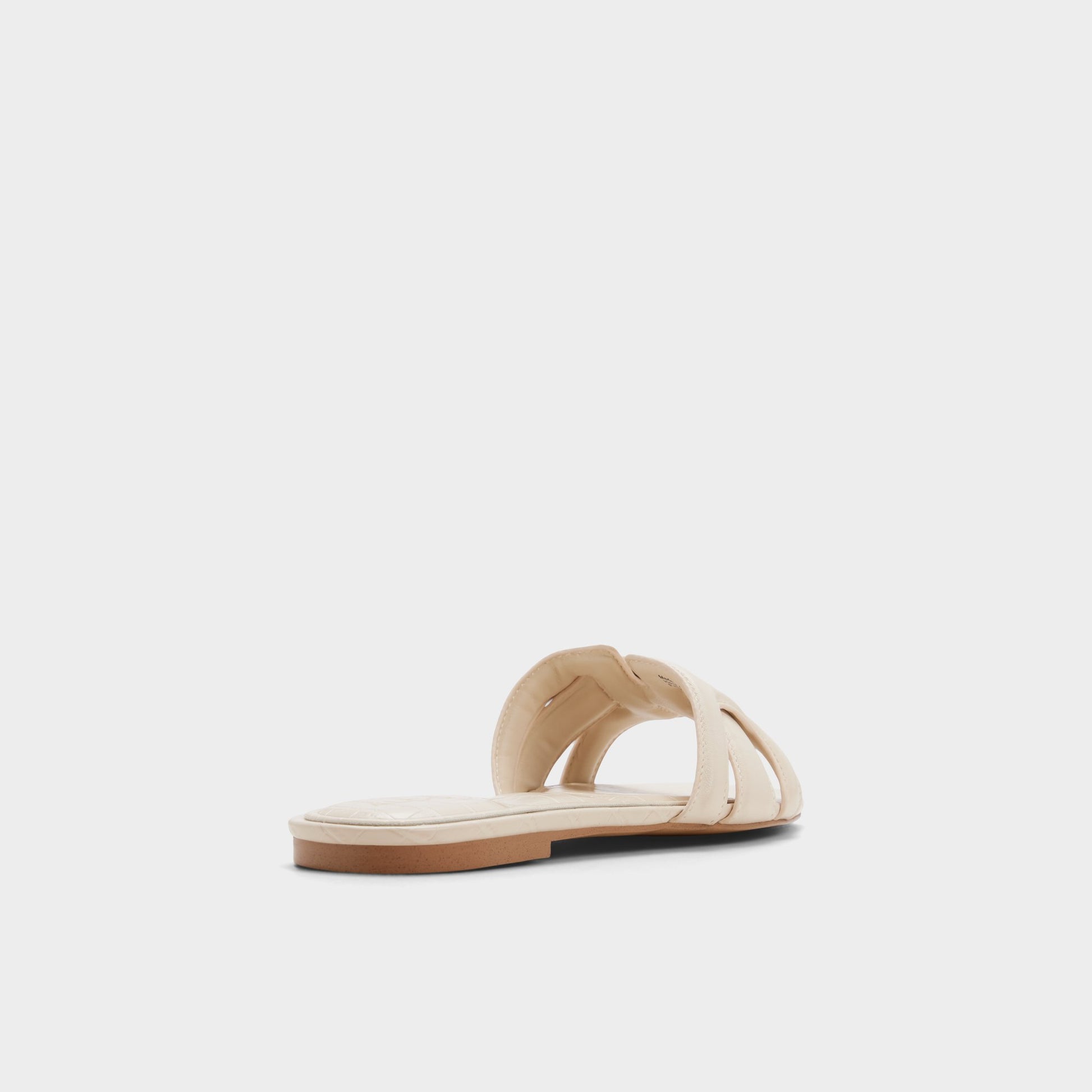 Three-quarter angle of Cream Elenaria Slide sandal's back side