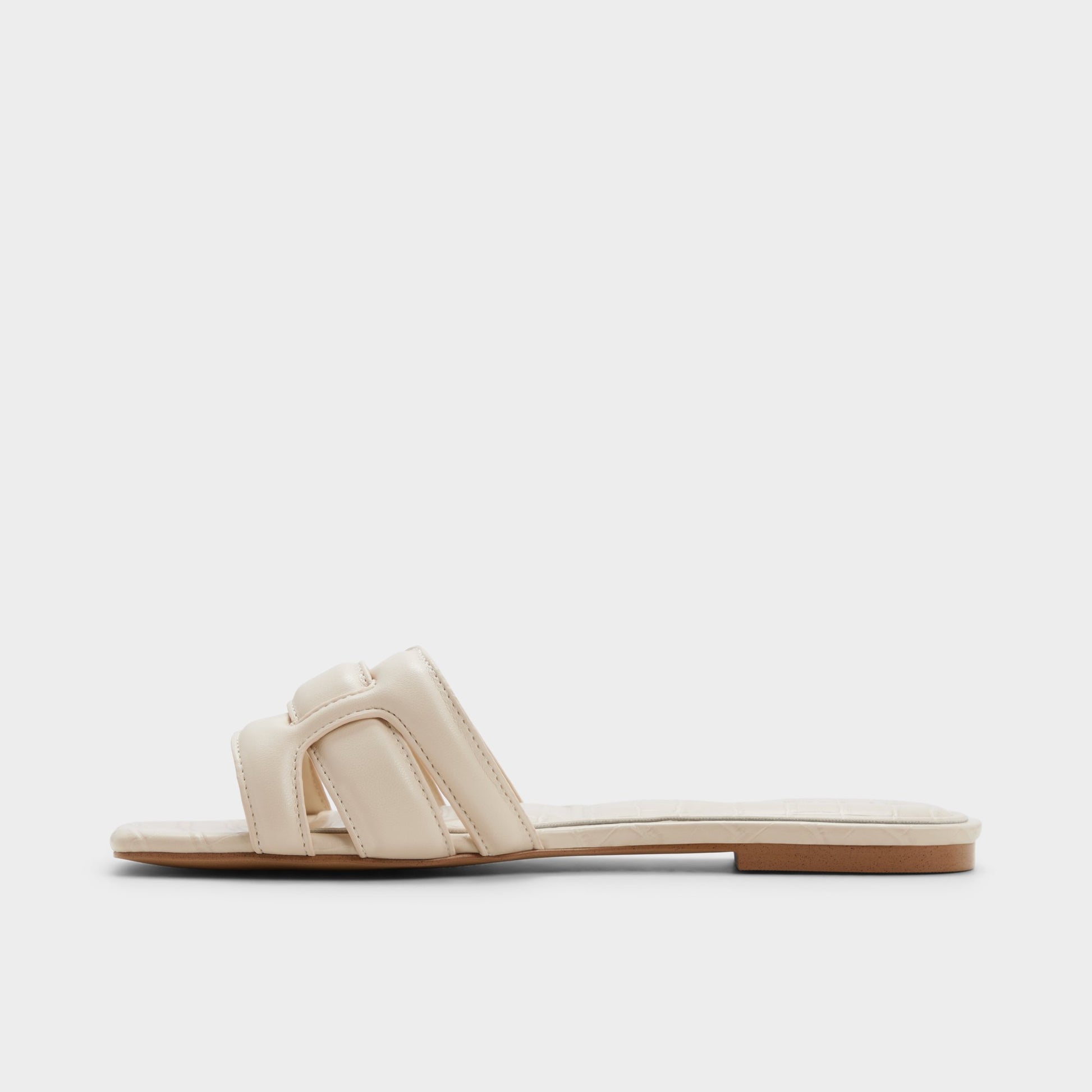 Side view of Cream Elenaria Slide sandal