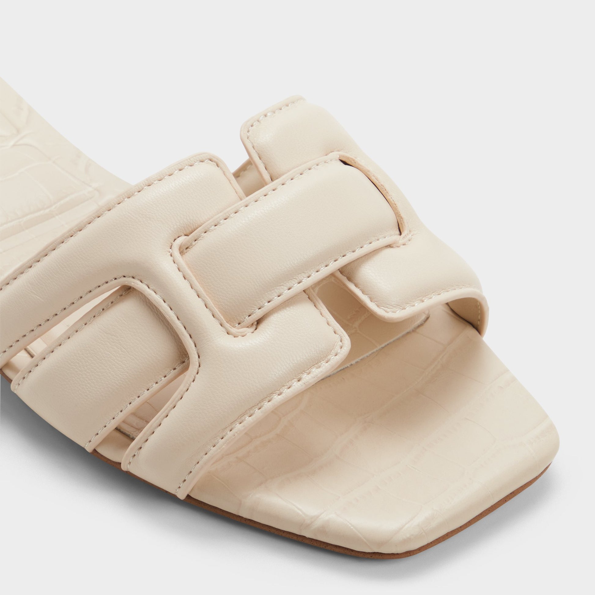 Close-up of the Cream Elenaria Slide sandal