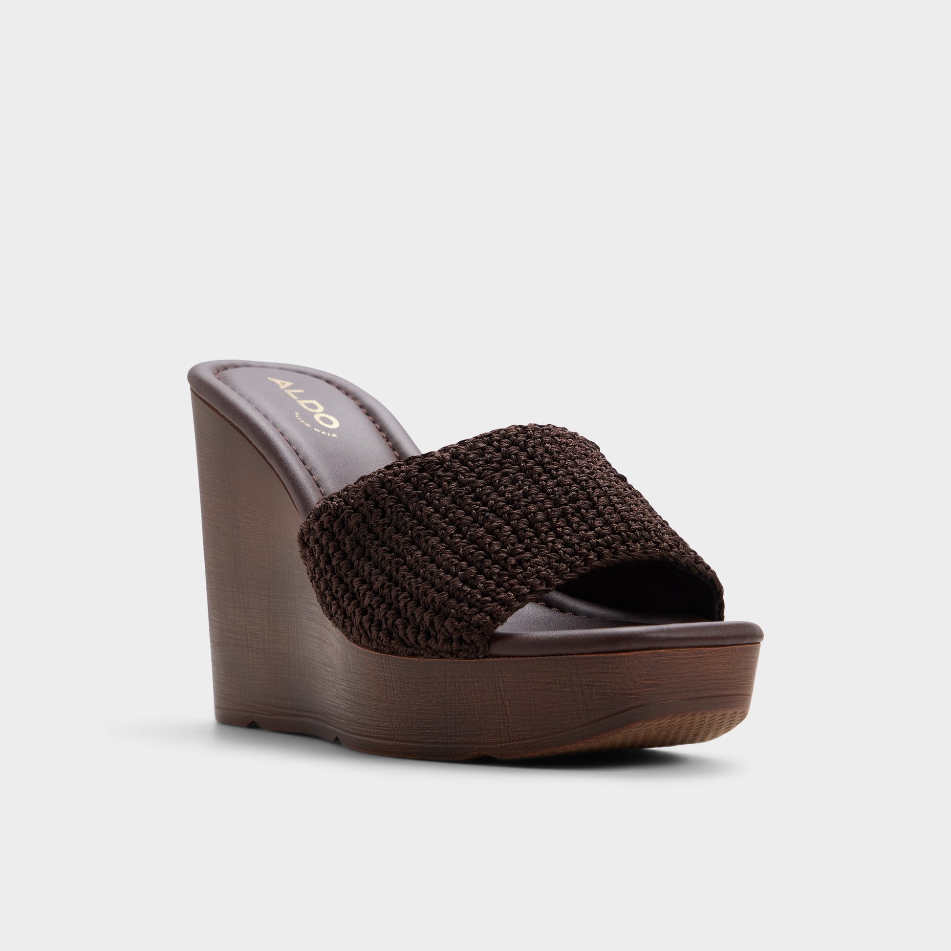 Three-quarter angle of Dark brown Grounded Wedge sandal's front side