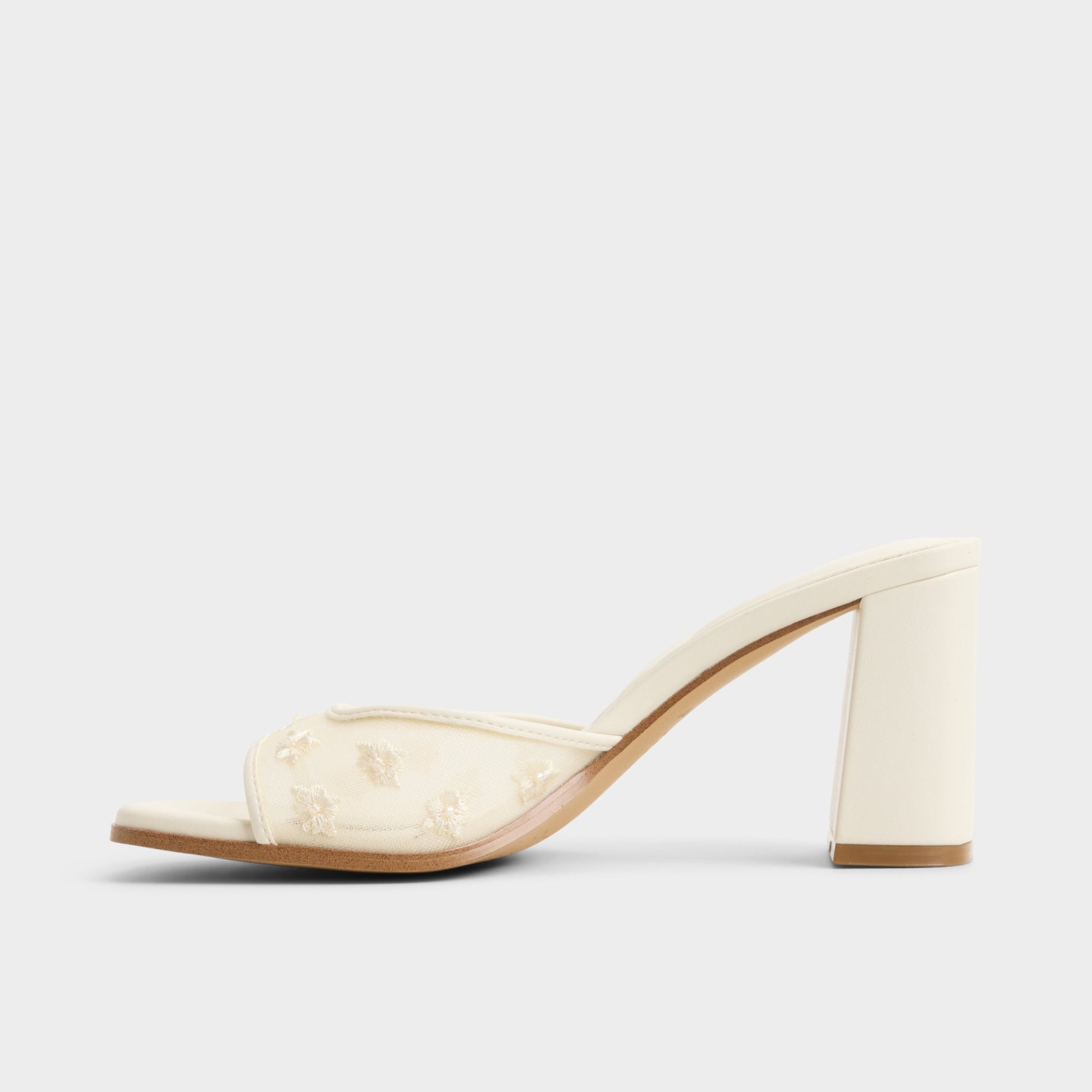 Side view of Other white Lisarae Heeled mule