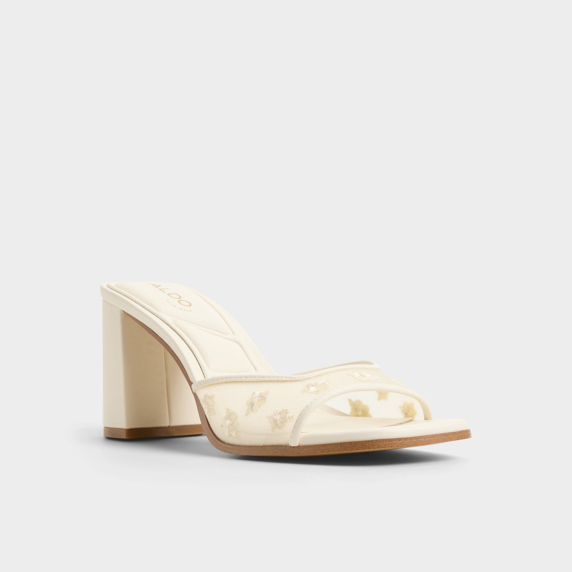 Three-quarter angle of Other white Lisarae Heeled mule's front side