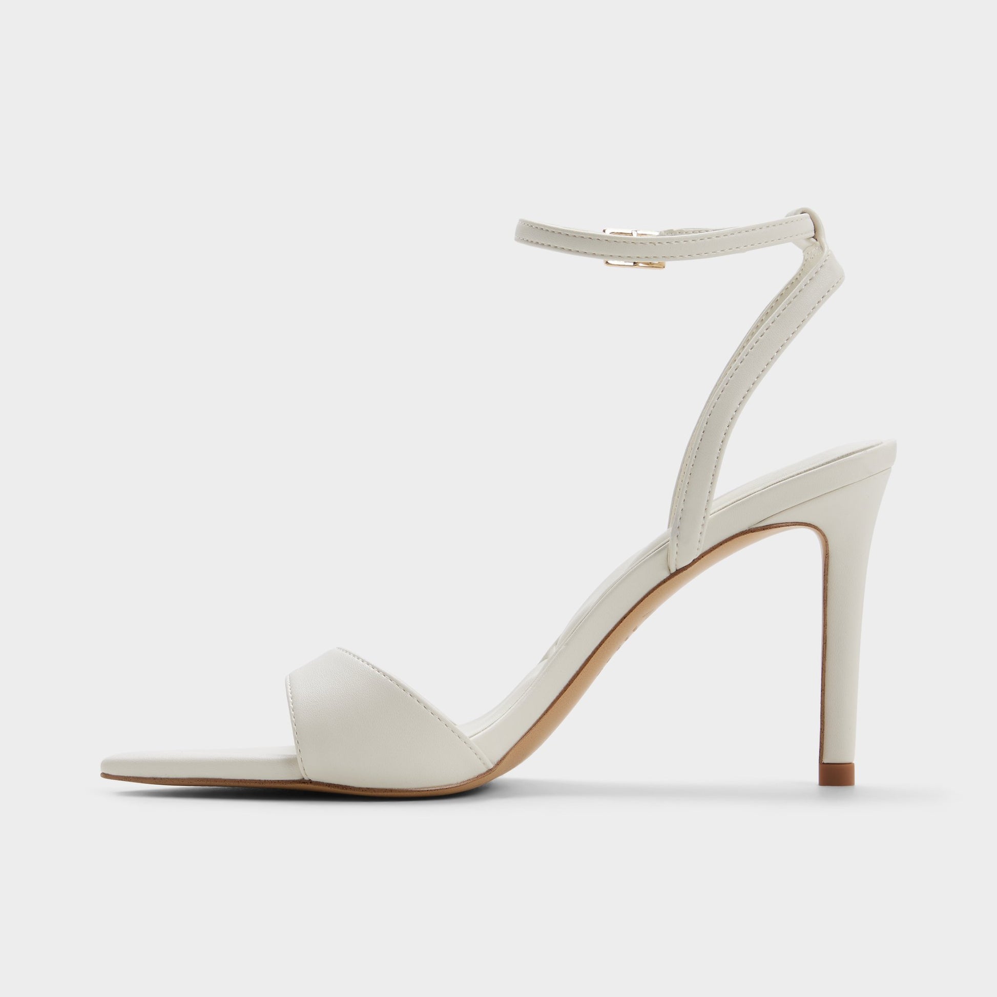 Side view of White/bone Leandra Strappy heeled sandal