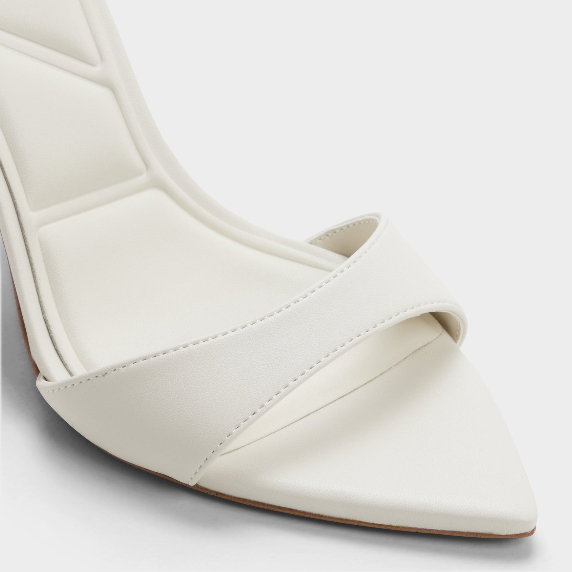 Close-up of the White/bone Leandra Strappy heeled sandal