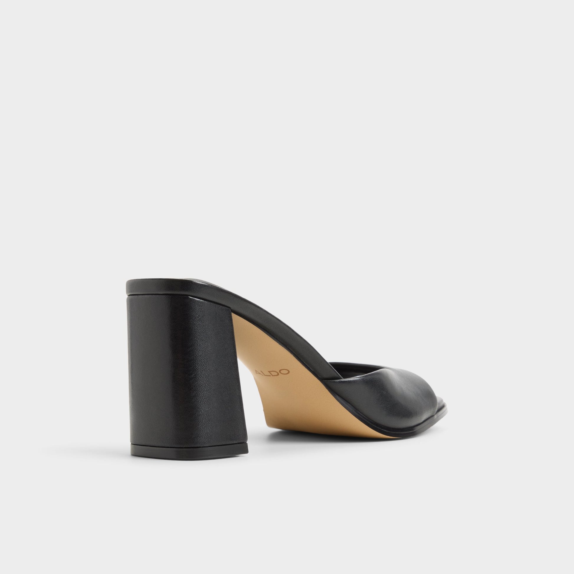 Three-quarter angle of Black Lisia Heeled mule's back side