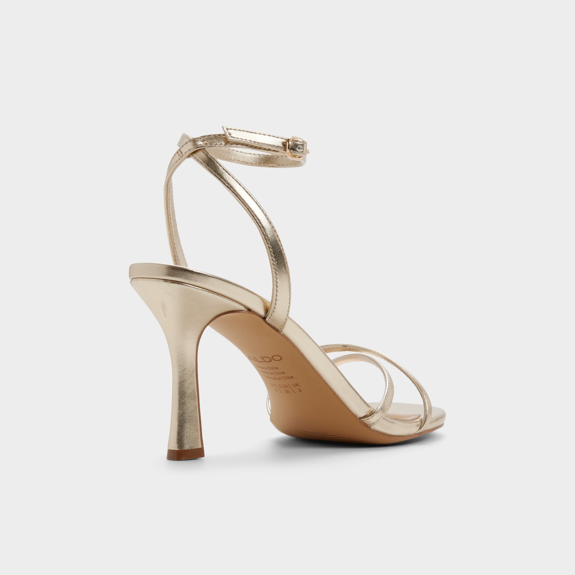 Three-quarter angle of Champagne Marbela Strappy heeled sandal's back side