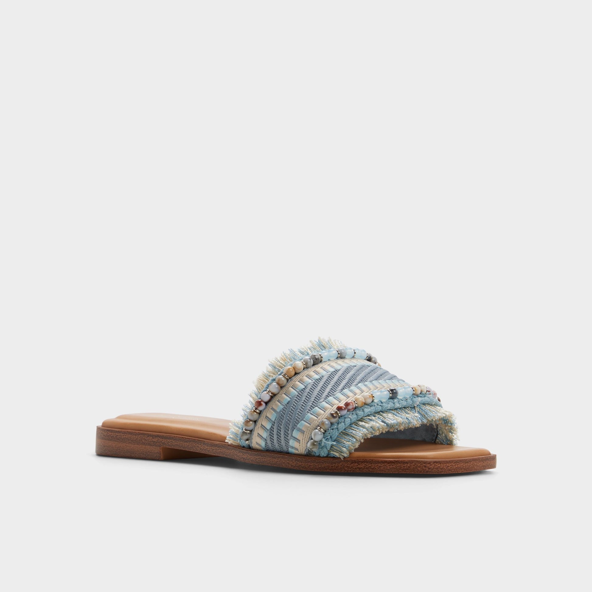 Three-quarter angle of Other blue Aurana Slide sandal's front side