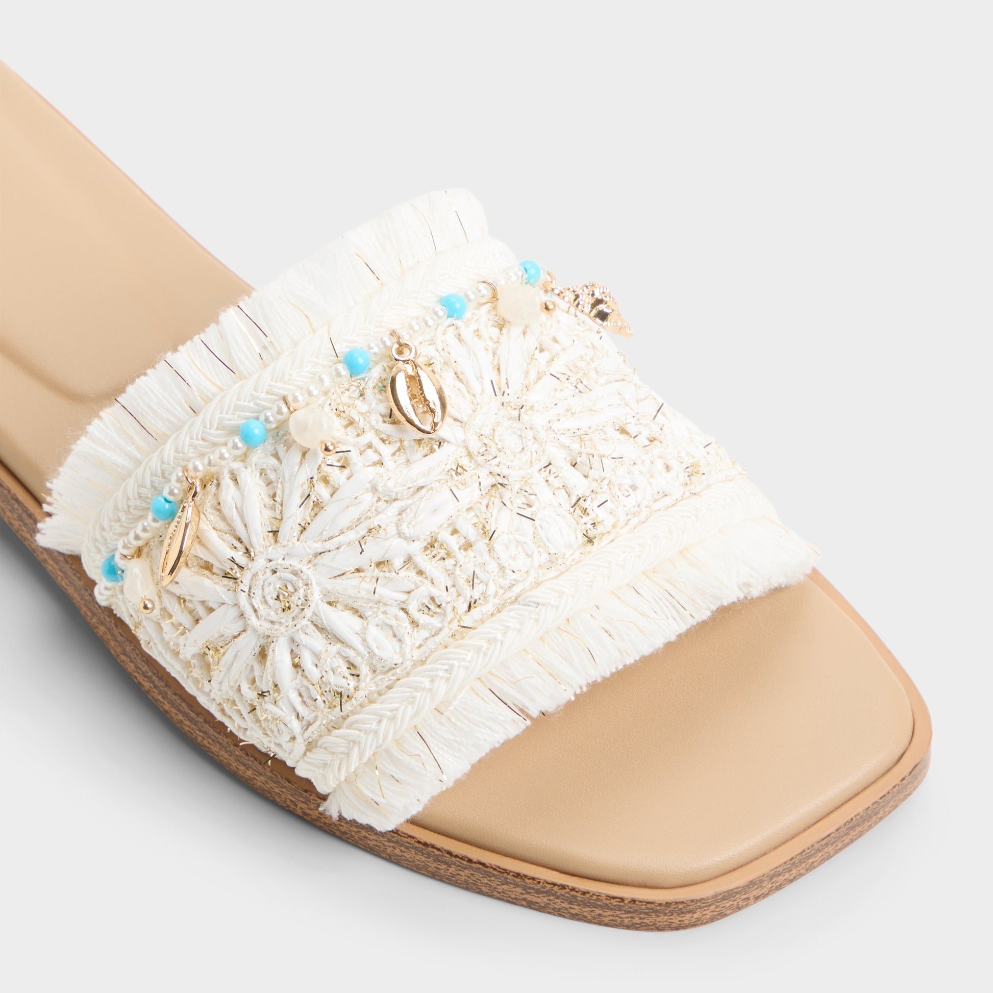 Close-up of the White/bone Aurana Slide sandal