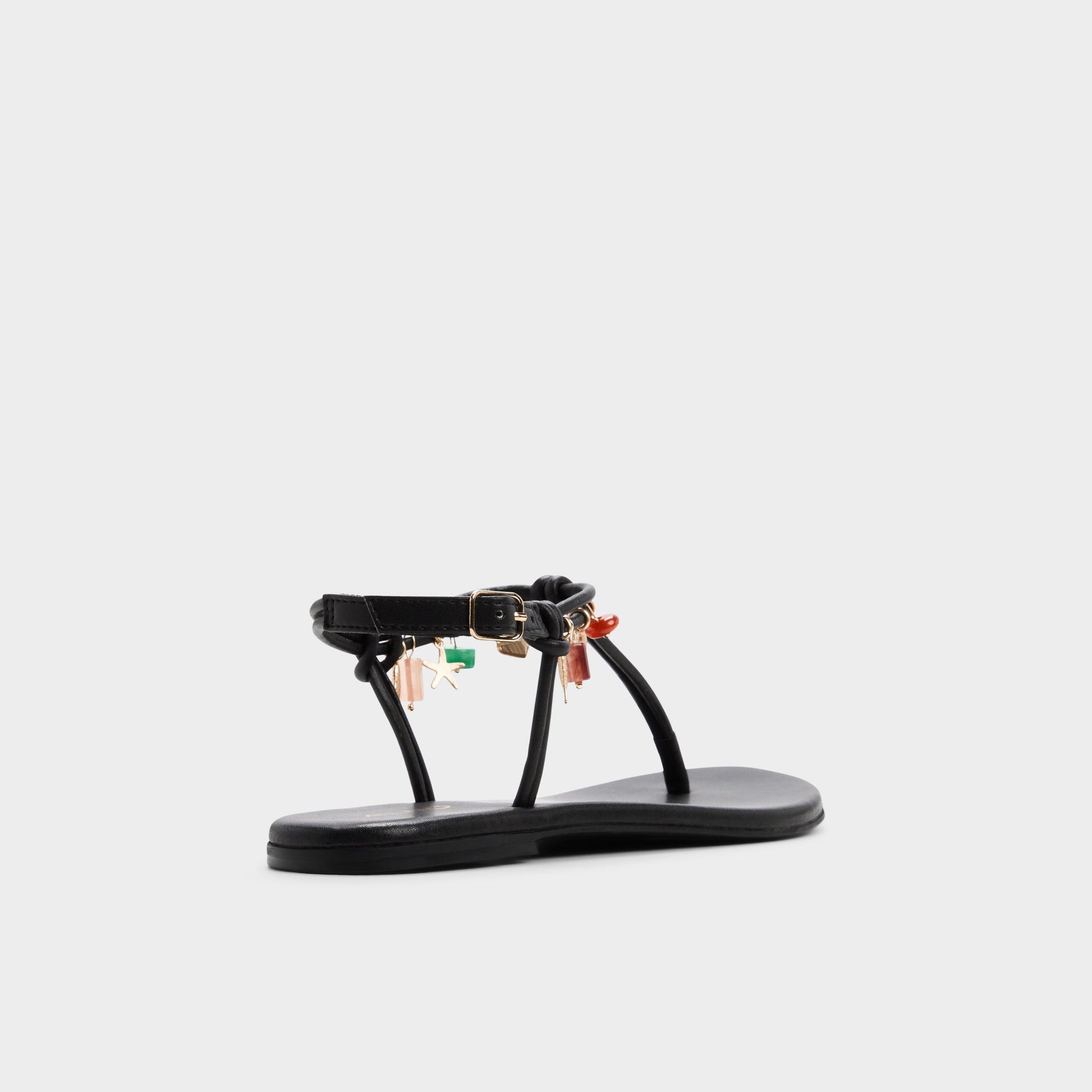 Three-quarter angle of Black Seajewels T-strap sandal's back side