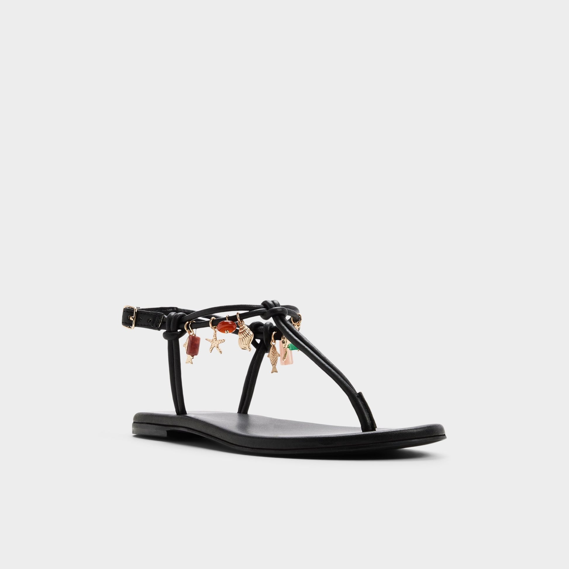 Three-quarter angle of Black Seajewels T-strap sandal's front side